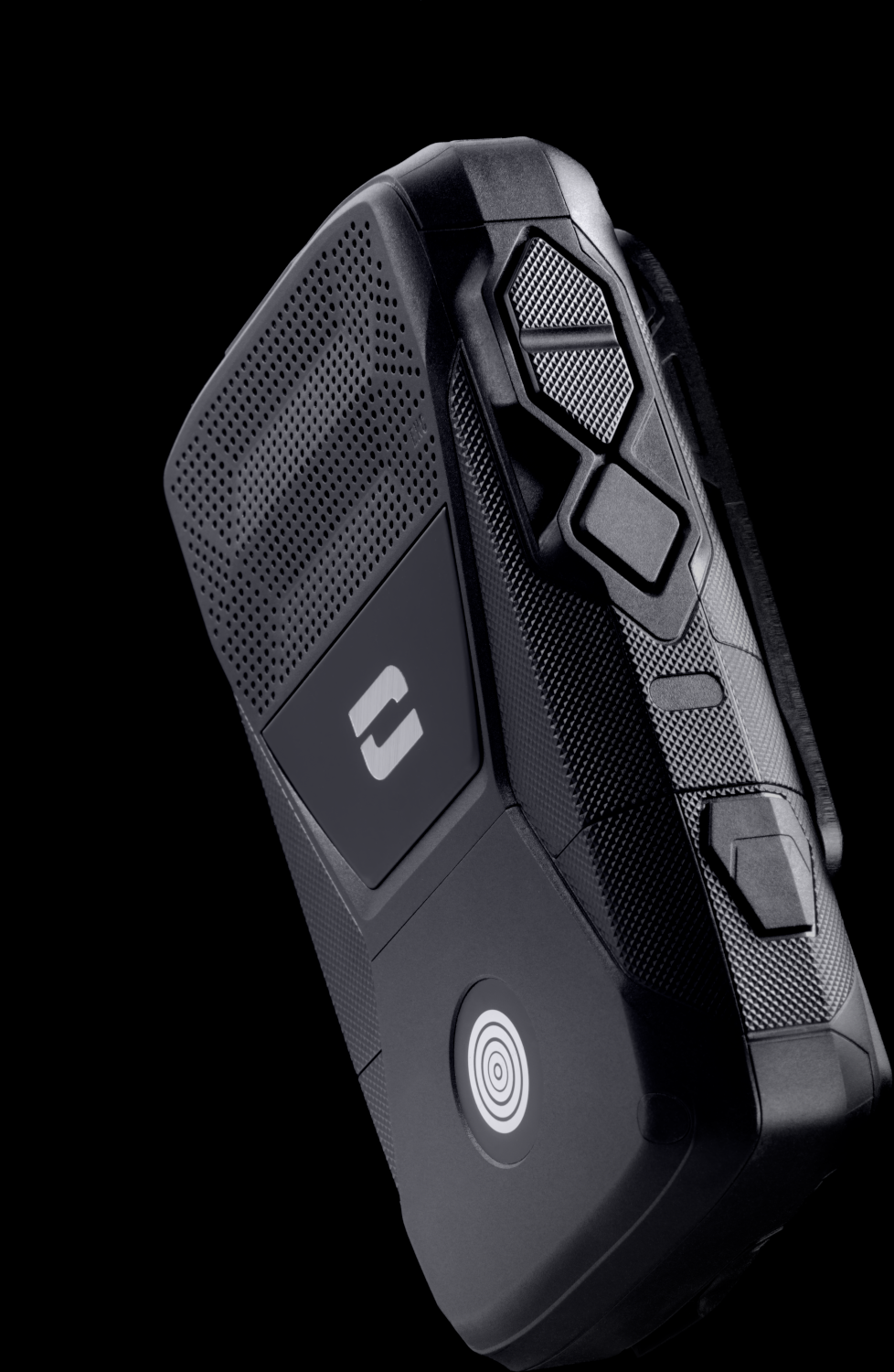 A black, textured, handheld device with buttons and a speaker grill, on a black background.