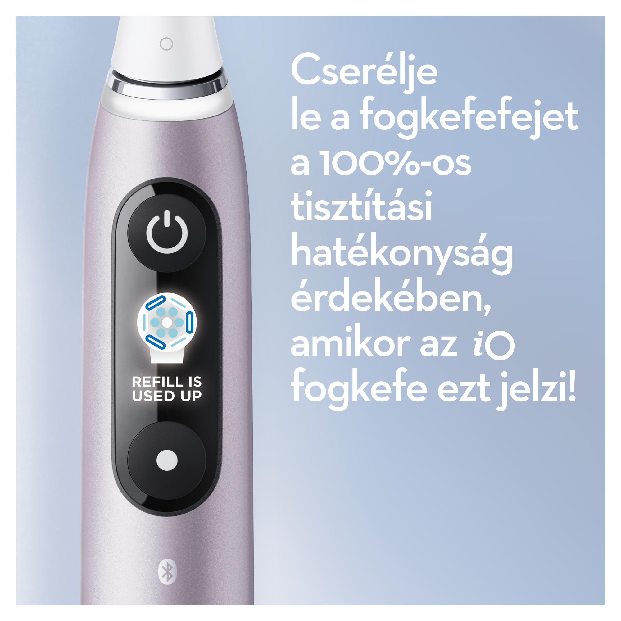 Lila fogkefefej gombbal és kijelzővel, amely egy szimbólumot mutat.