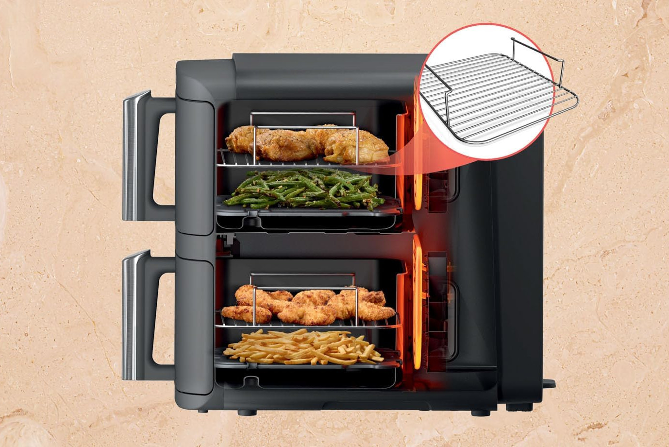 Frytownica powietrzna z jedzeniem w środku i tacą podświetloną na czerwono.