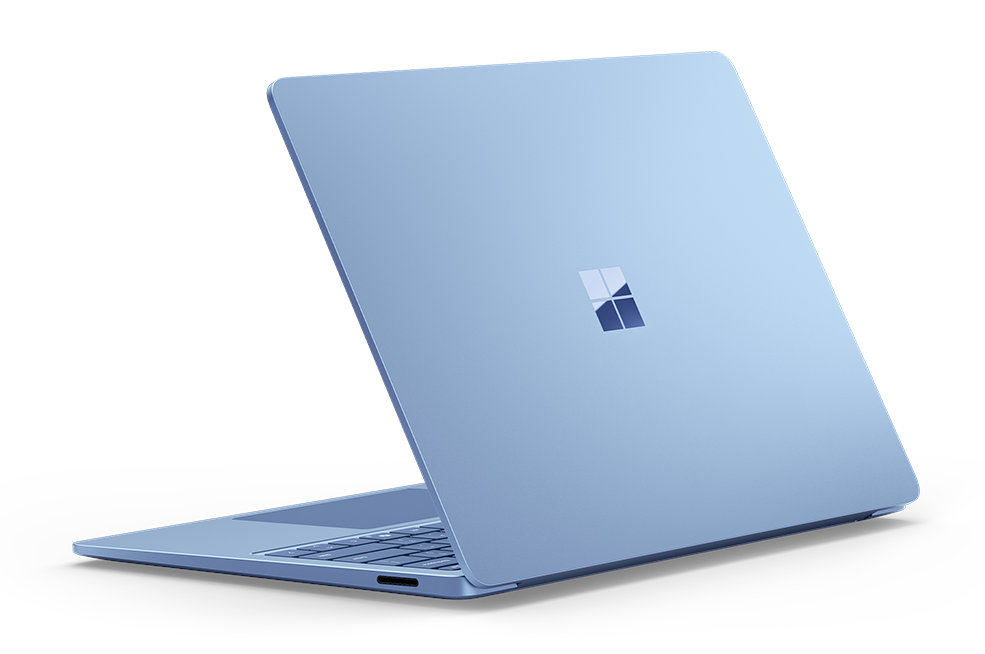 Niebieski laptop z logo Microsoft na pokrywie.