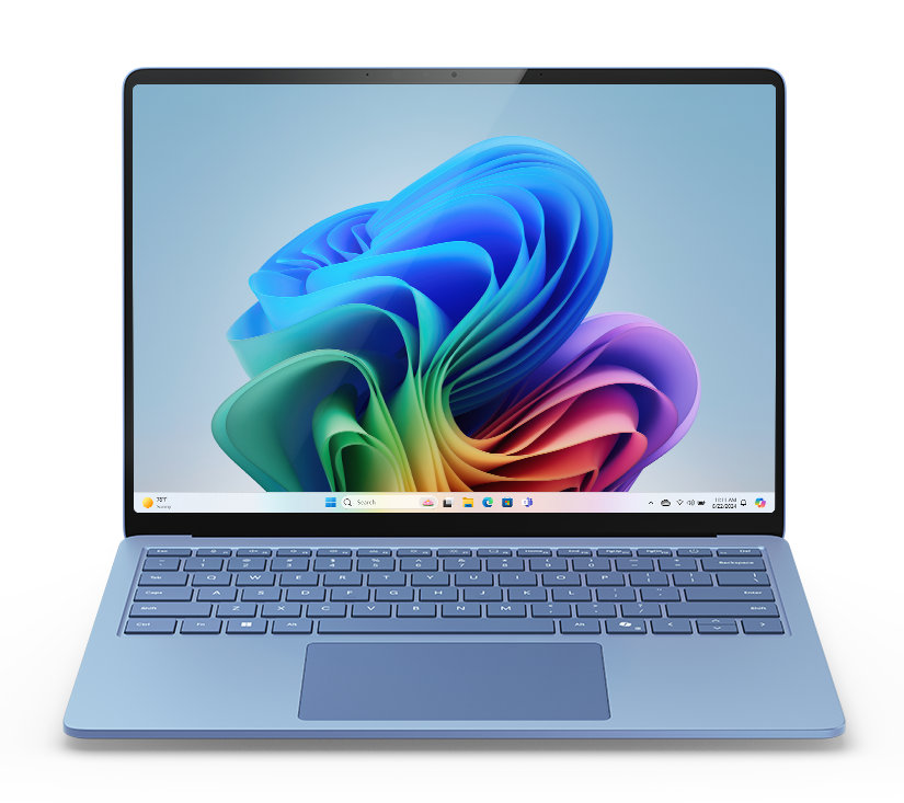 Niebieski laptop z niebieską klawiaturą. Ekran wyświetla kolorowy abstrakcyjny obraz na białym tle.