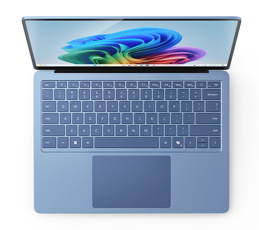 Niebieski laptop z góry, otwarty z kolorowym ekranem.