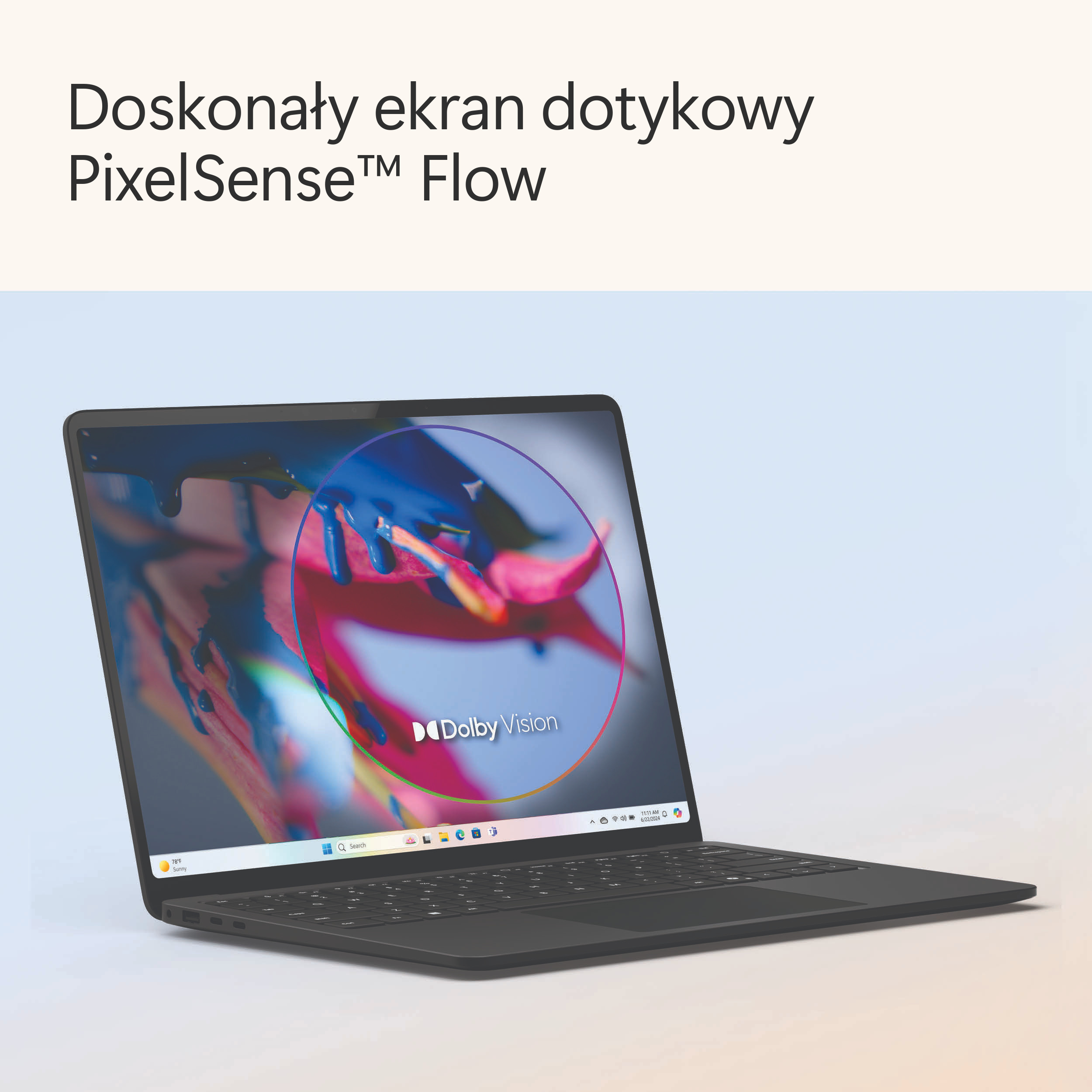 Ciemnoszary laptop z ekranem wyświetlającym kolorowy, abstrakcyjny obraz.