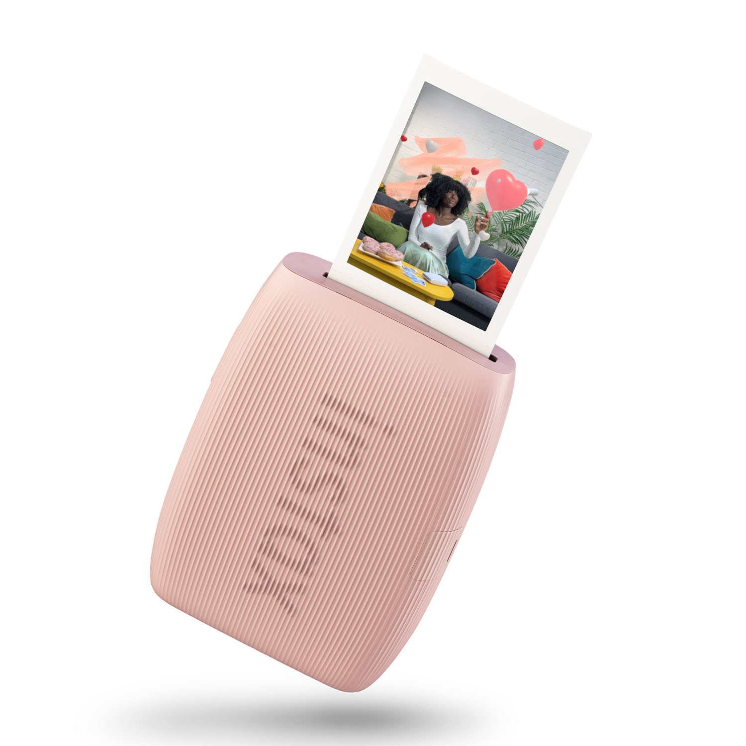 Stampante fotografica portatile rosa. Una foto viene espulsa dall'alto.