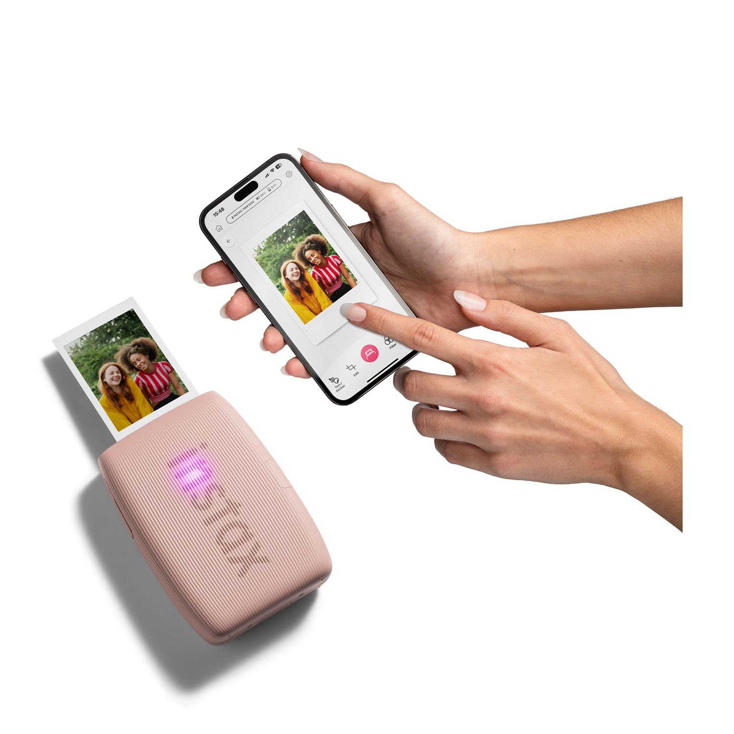 Una stampante portatile rosa che stampa una foto da un telefono.