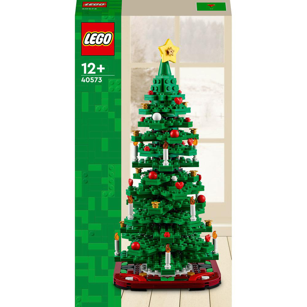 LEGO Weihnachtsbaummodell mit Ornamenten, auf grüner und roter Basis, Box sichtbar.