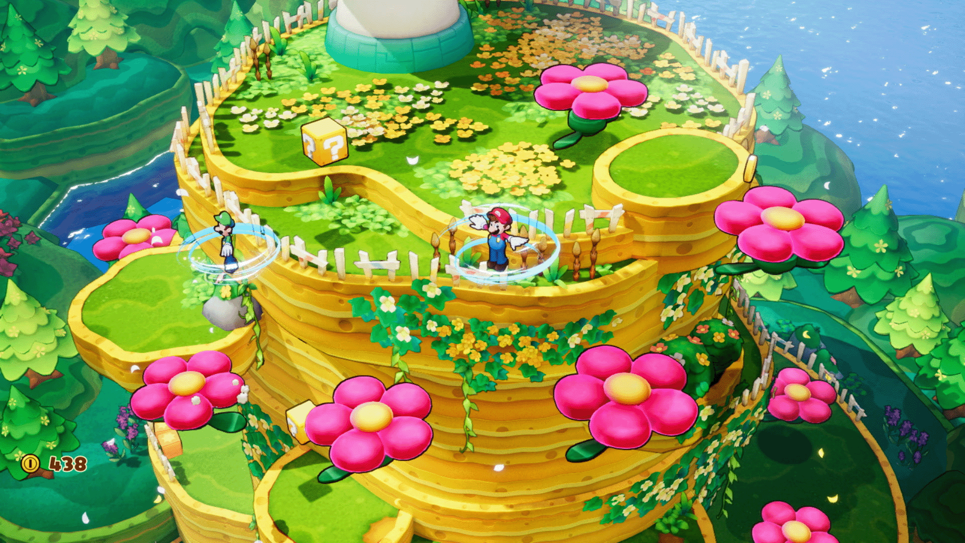 Eine farbenfrohe Spielszene mit Mario und Luigi auf einer blütenreichen Plattform.