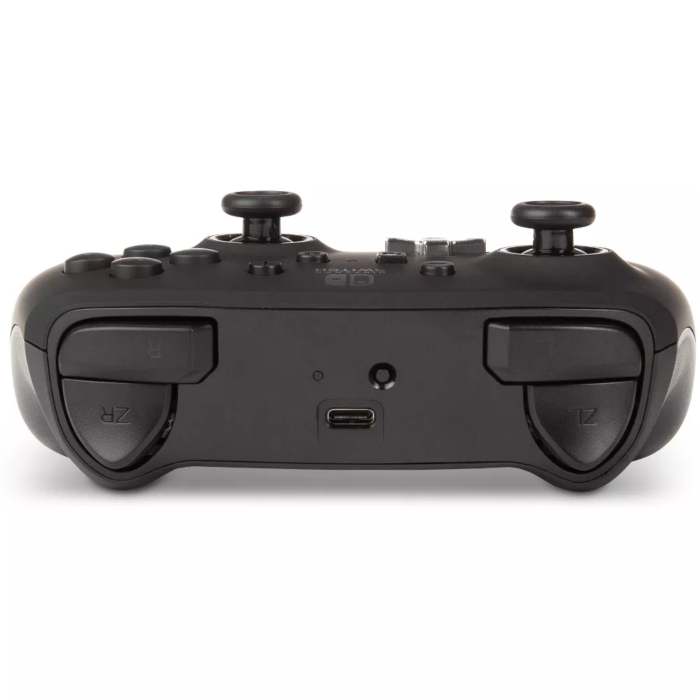 İki joystick, düğmeler ve bir USB bağlantı noktası olan siyah bir oyun konsolu denetleyicisi.