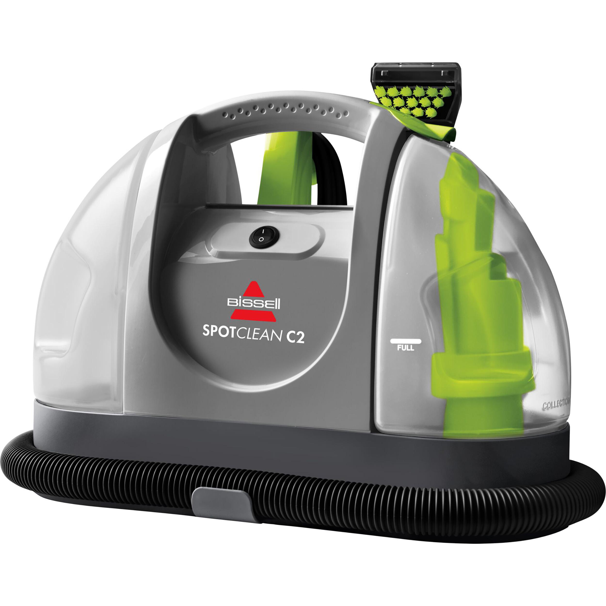 Ein grauer und klarer Bissell SpotClean C2 Reiniger mit grünem Aufsatz.