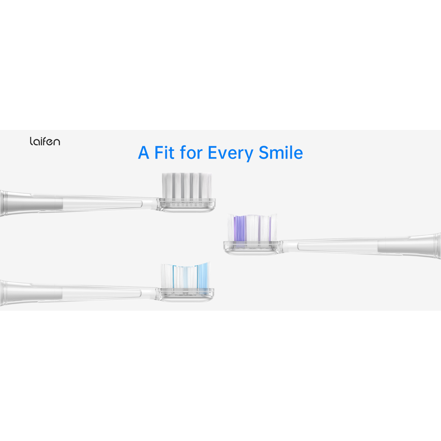Four toothbrush heads, each with different colored bristles, laid out on a white surface.