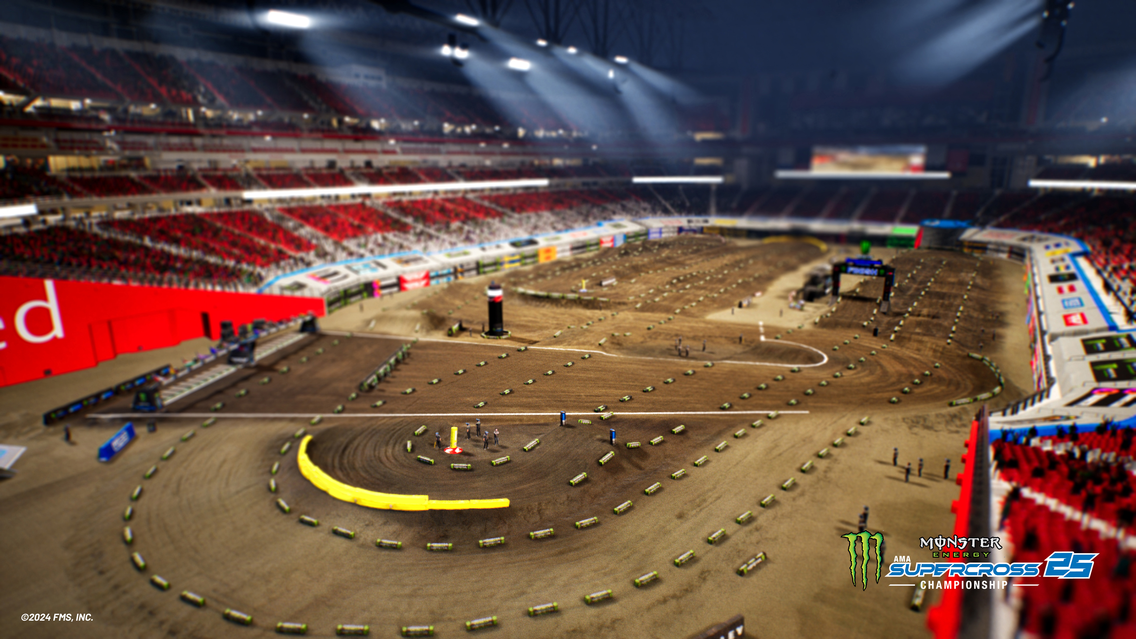 Een racebaan met dirt jumps en stadionzitplaatsen.