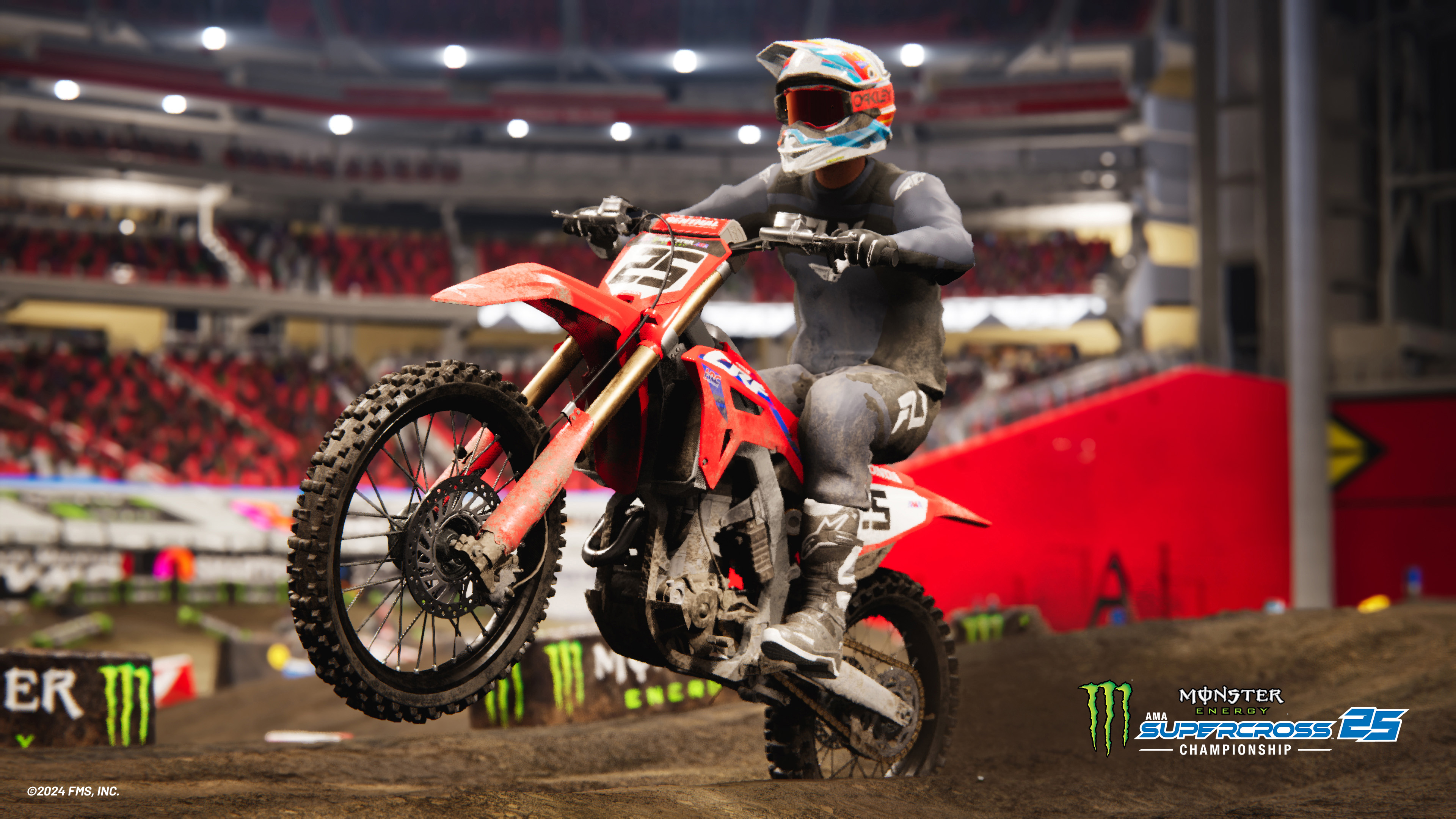 Een motorcrosser springt met een rode motor in het stadion.