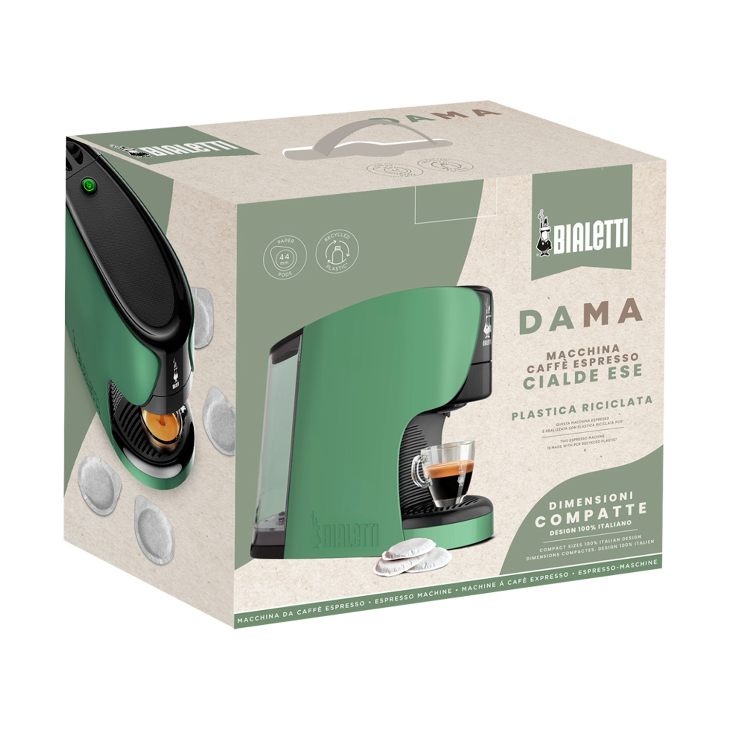 Una macchina da caffè verde in una scatola con cialde e una tazza di caffè.