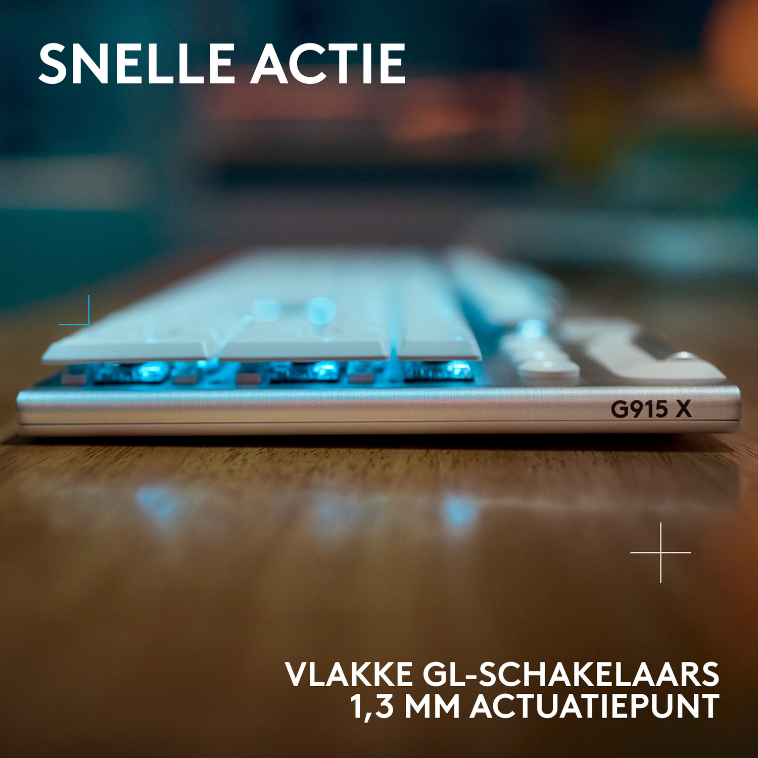 A keyboard with blue lights under the keys. The model is G915 X, with 1.3 mm actuation point.