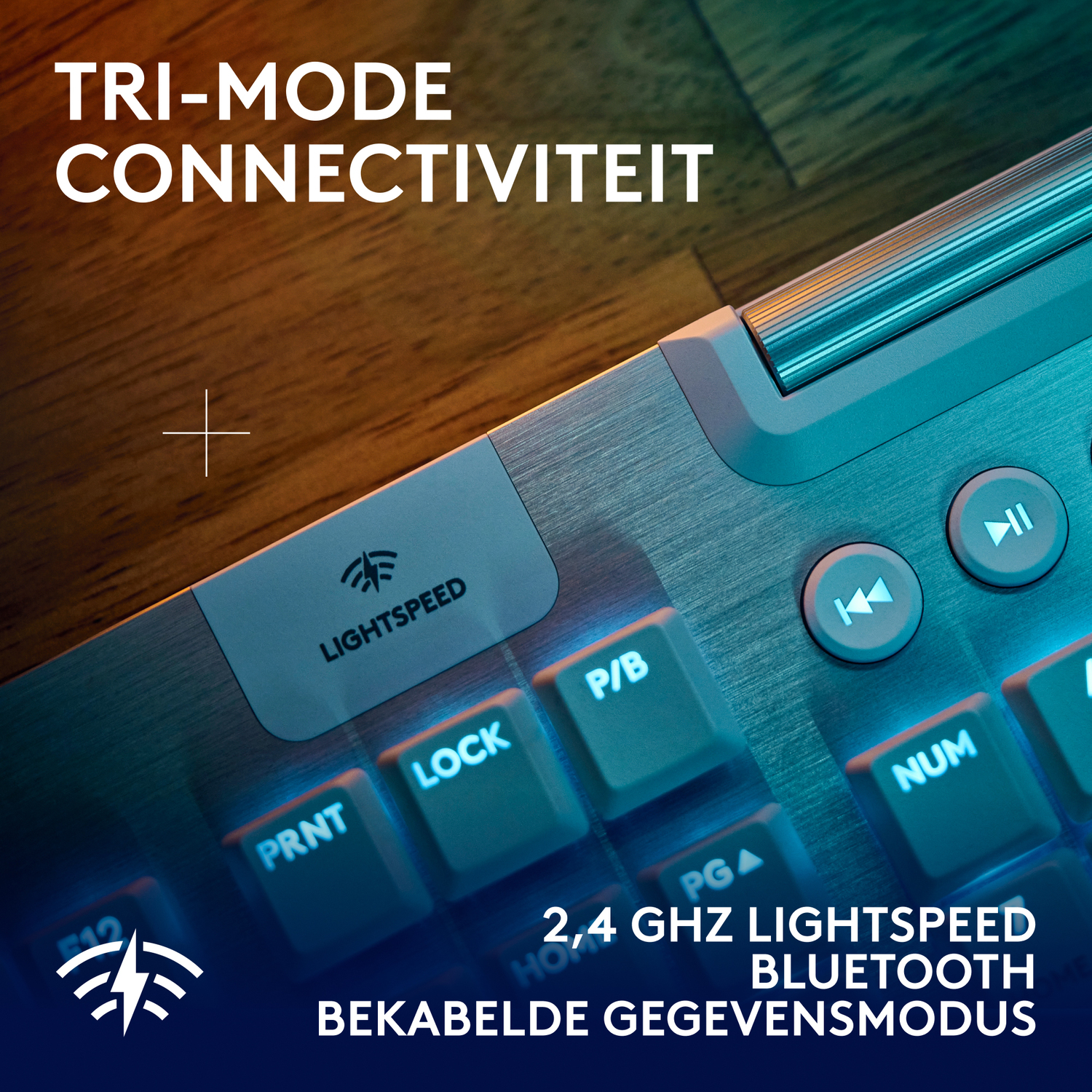 Keyboard with white keys and blue lights. Text: Tri-mode connectivity, 2.4 GHz Lightspeed.