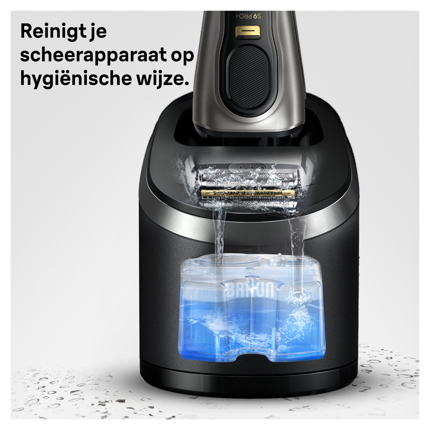 A shaver is placed inside a black cleaning station filled with blue liquid.