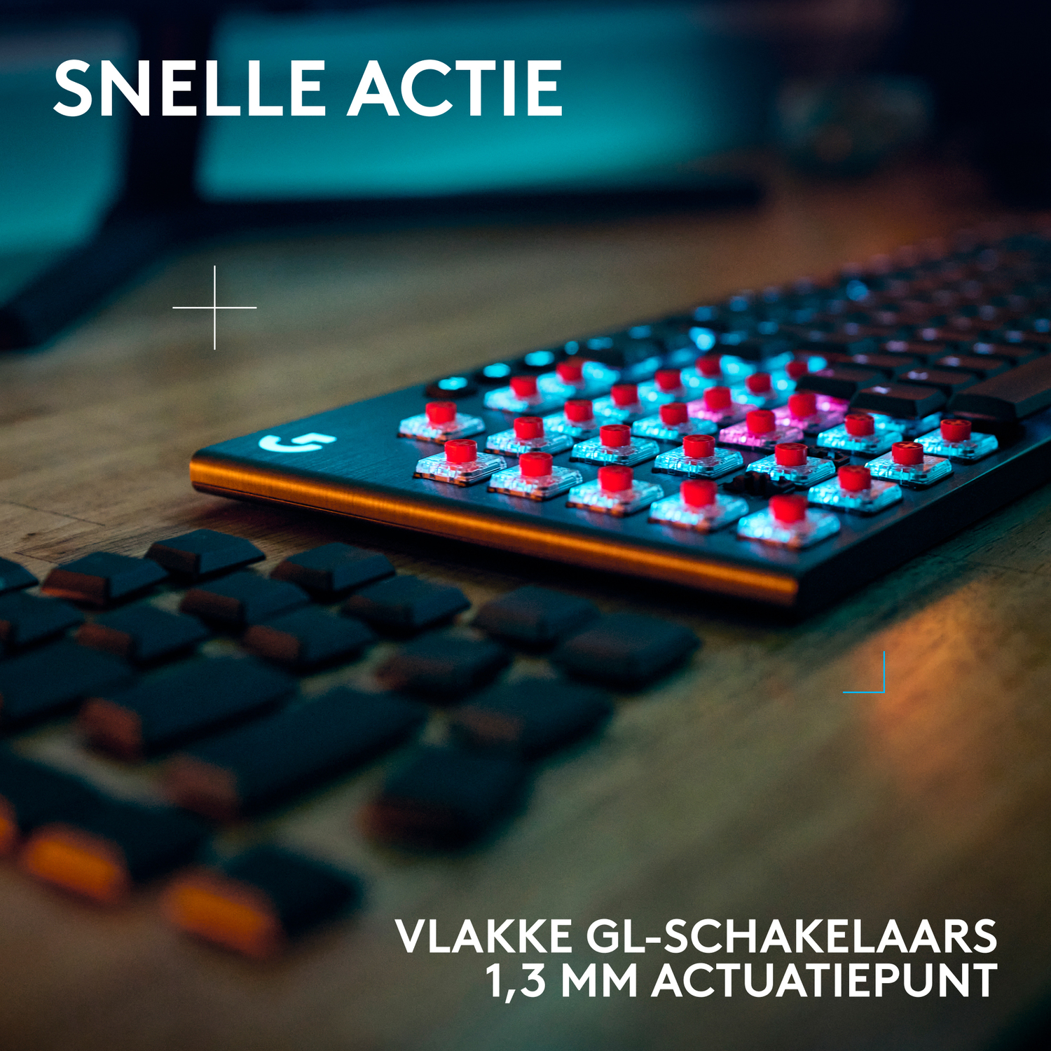 Keyboard with red keys, removed keys below. Blue and orange lighting.