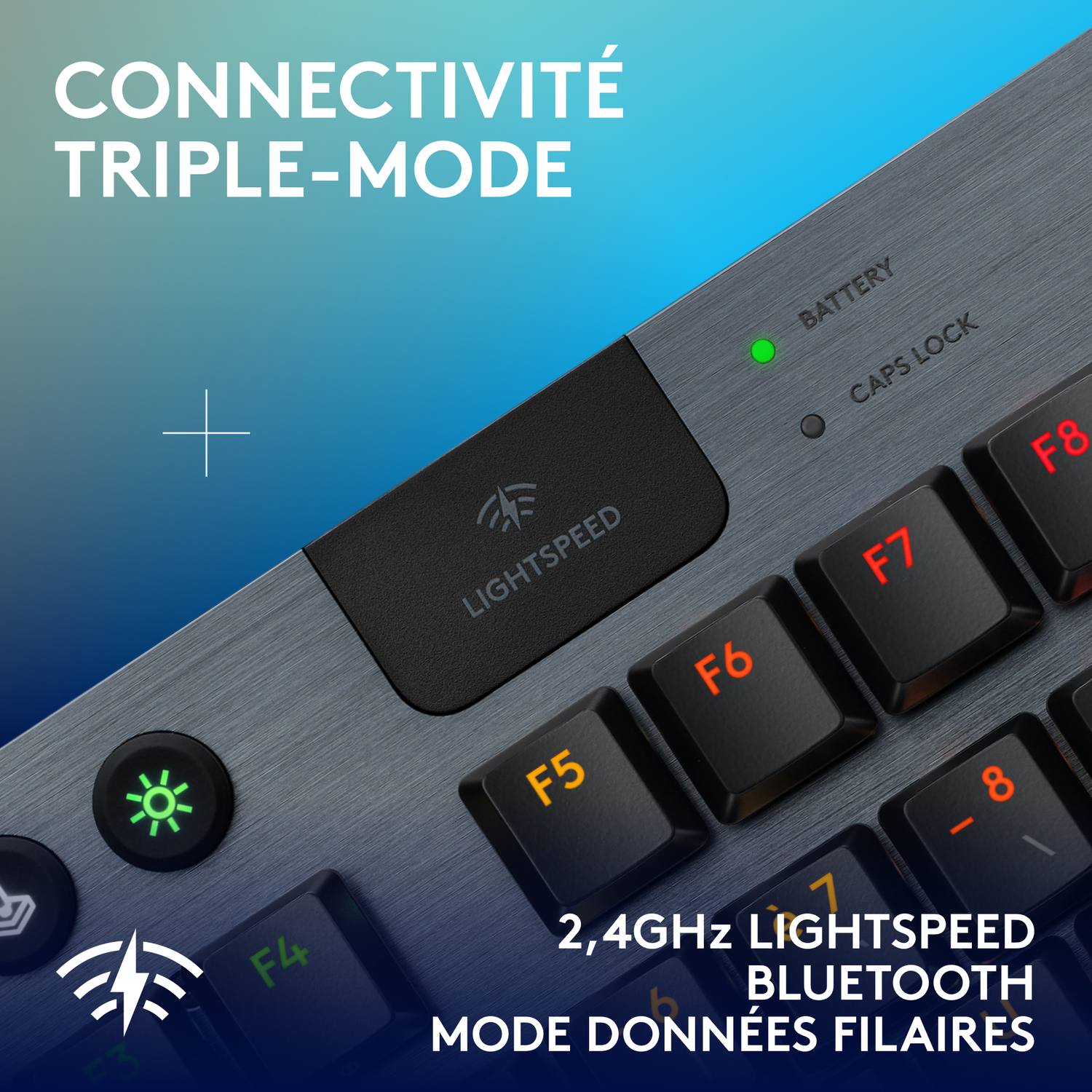 Un clavier avec des touches de couleurs noire et orange. Les mots disent '2,4 GHz LIGHTSPEED, BLUETOOTH'.