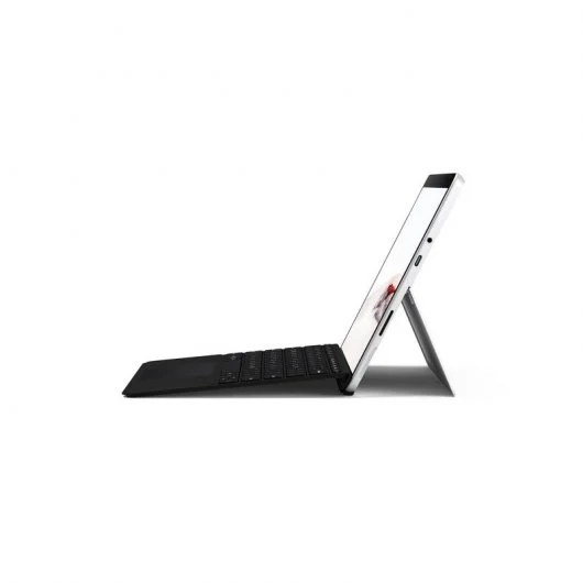 Un portátil en vista lateral, abierto con la pantalla hacia arriba y un teclado delante.