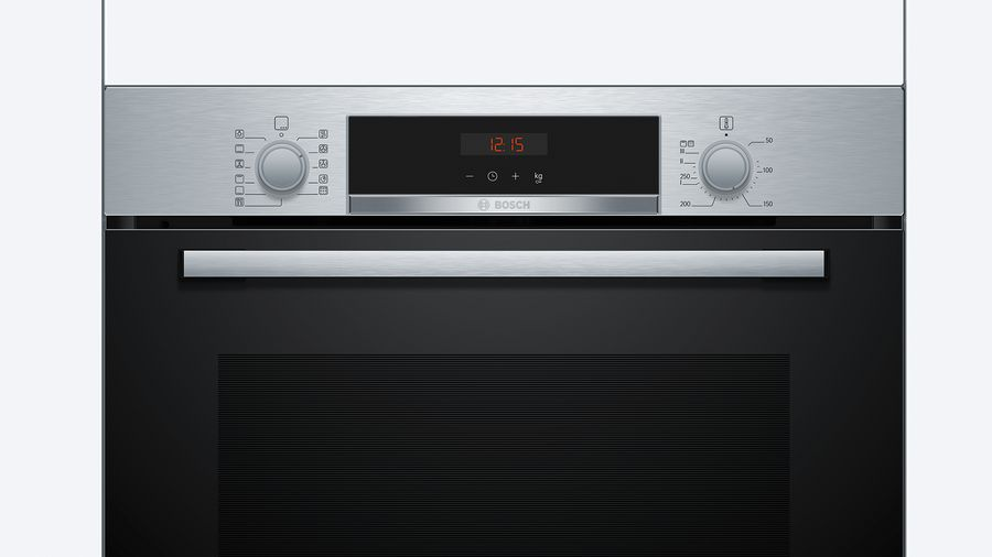 Un horno de acero inoxidable con una pantalla digital que muestra '12:15', con botones y diales.