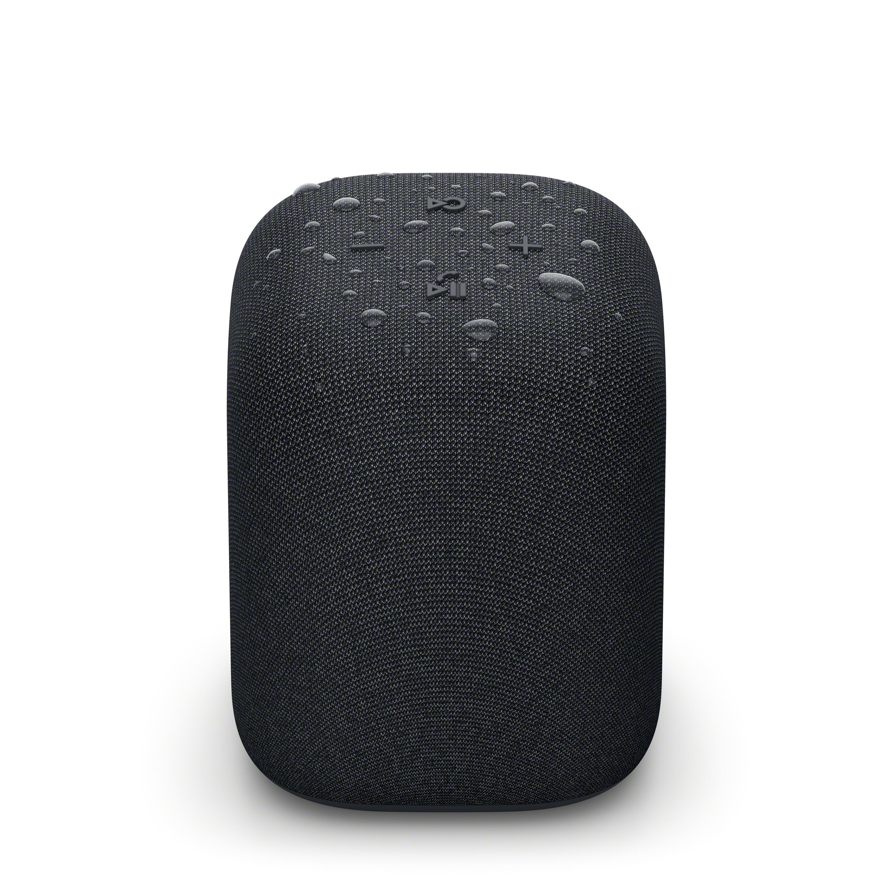 Altavoz negro cubierto de tela con gotas de agua.