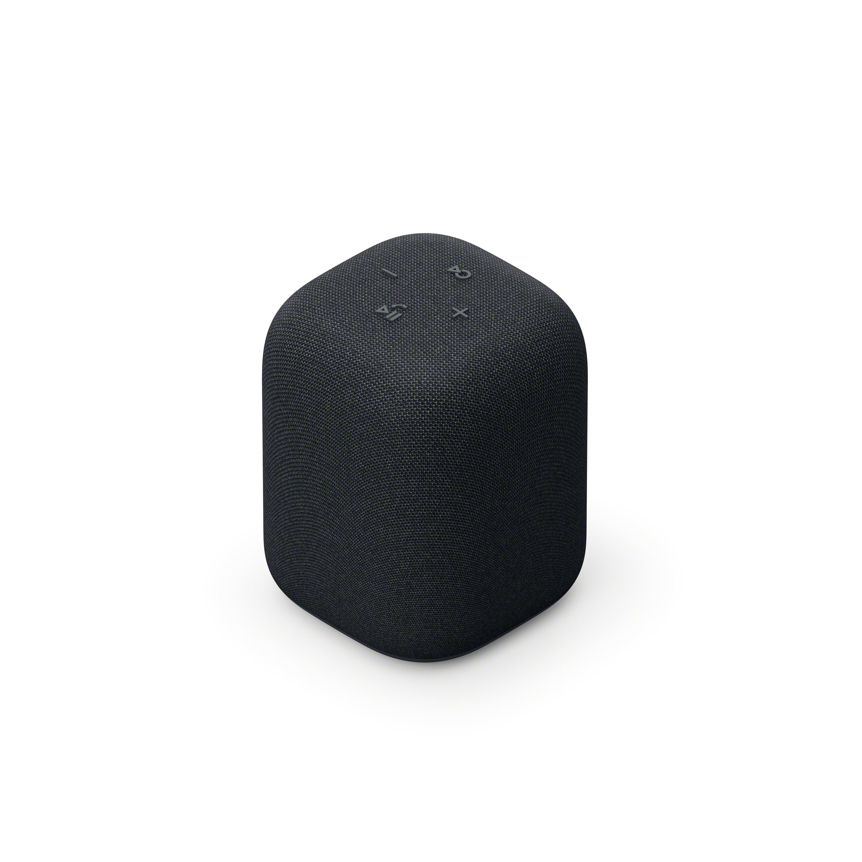 Un altavoz negro sobre un fondo blanco.