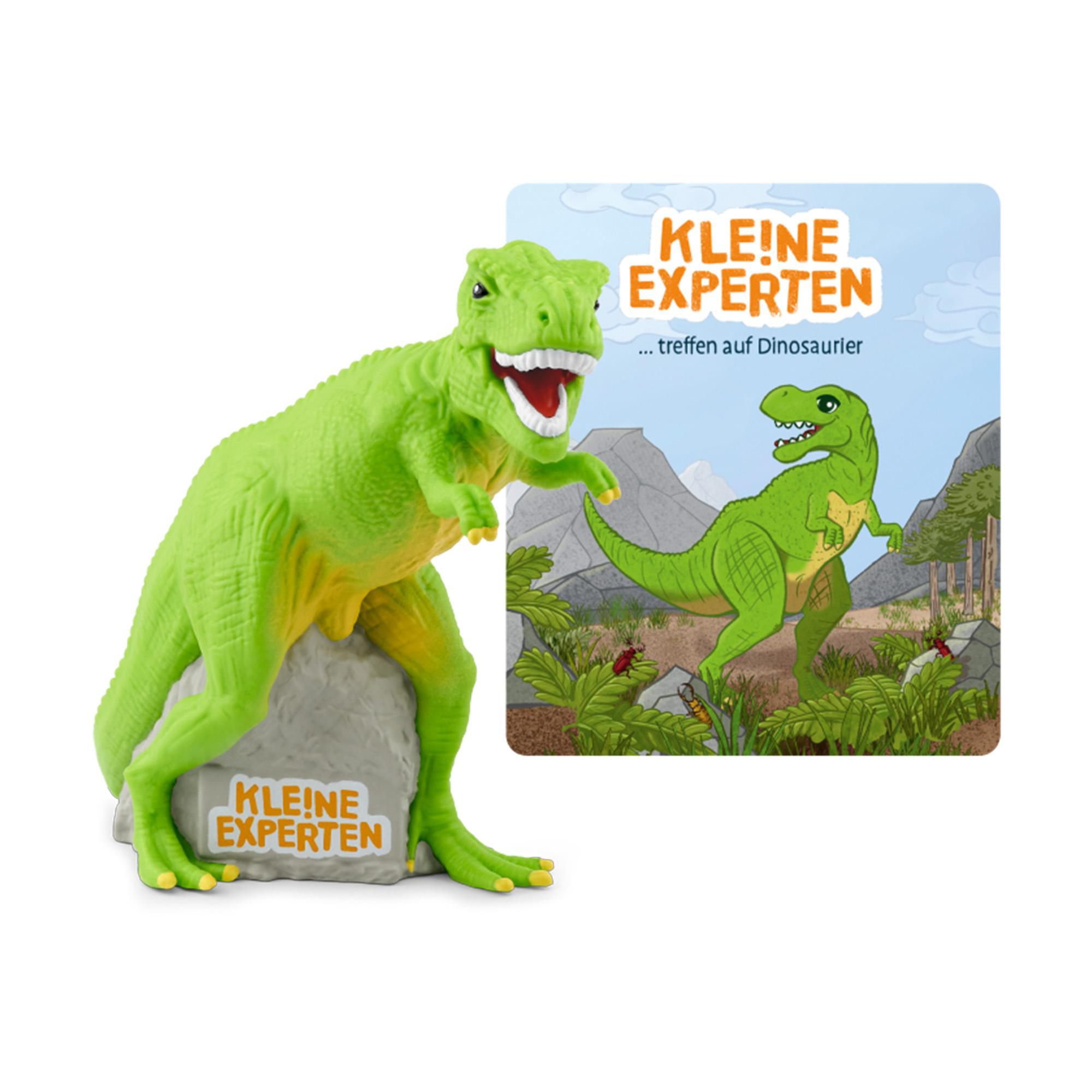 Ein grünes Dinosaurier-Spielzeug auf einem Felsen, mit einem Buchcover, das einen Dinosaurier zeigt.