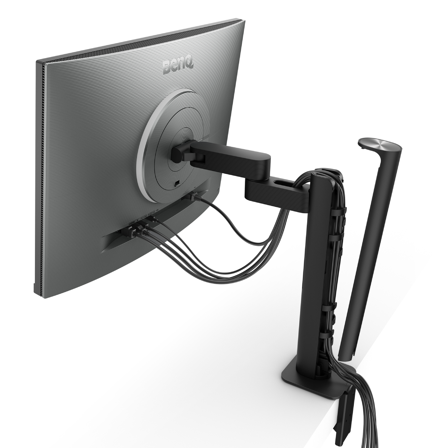 Un monitor con soporte negro, cables y un brazo de soporte, sobre una mesa blanca.