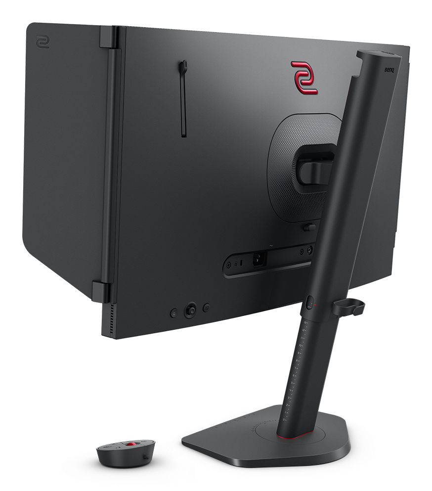 Parte trasera de un monitor con soporte. El monitor es negro. Un pequeño mando en la esquina inferior izquierda.