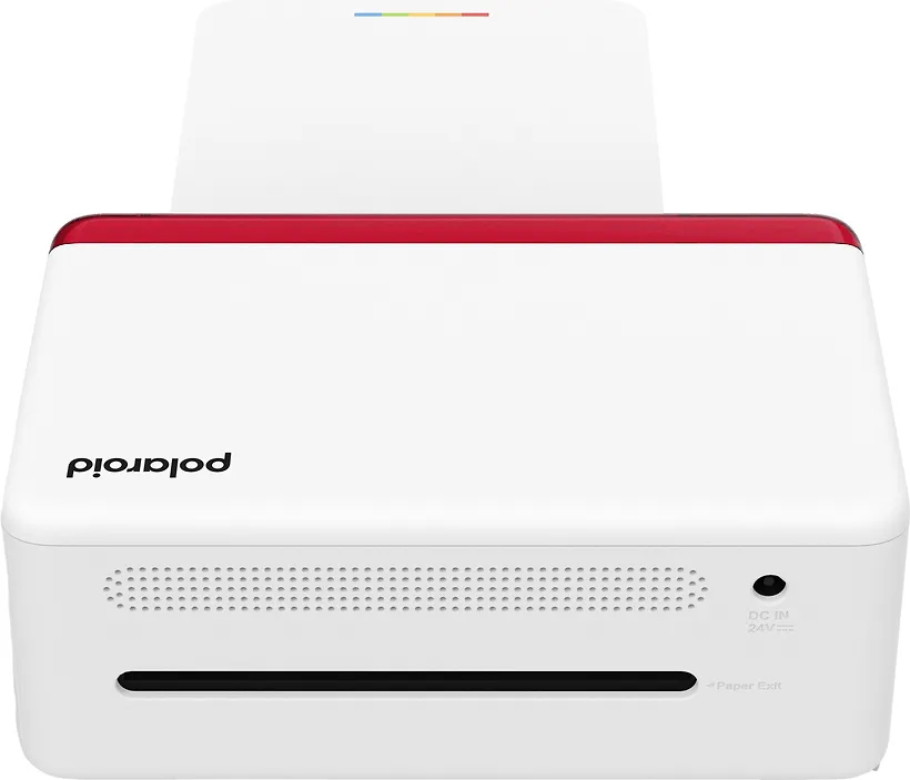 Fehér Polaroid fotónyomtató. A tetején szivárványcsík van. Papírkimeneti nyílás elöl.