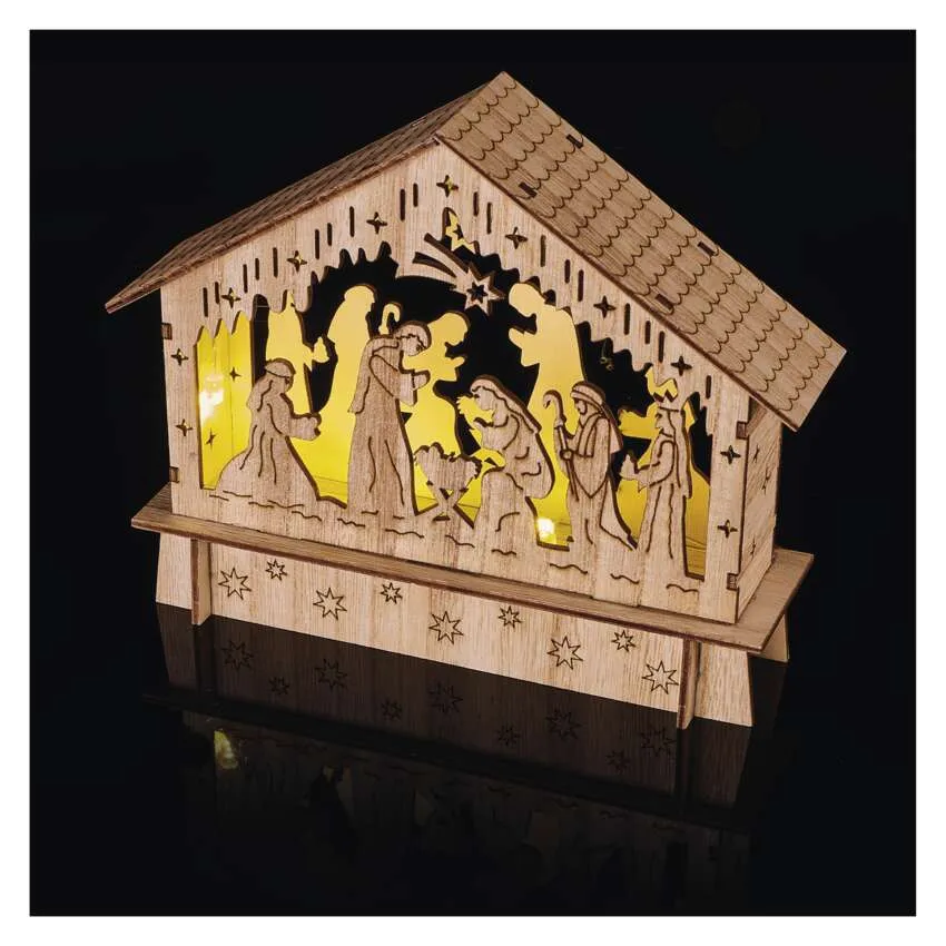 Fa betlehem figurákkal és fénnyel. A jelenet Jézus születése.