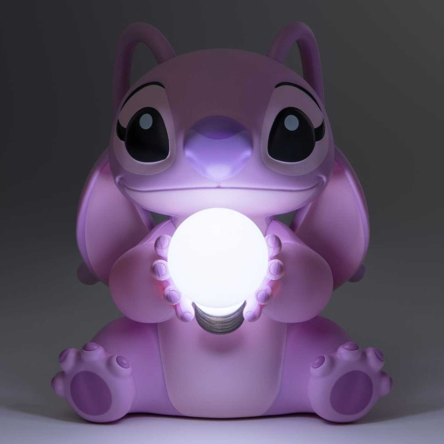 Angel from Lilo & Stitch holding a glowing orb, in a purple-toned setting.