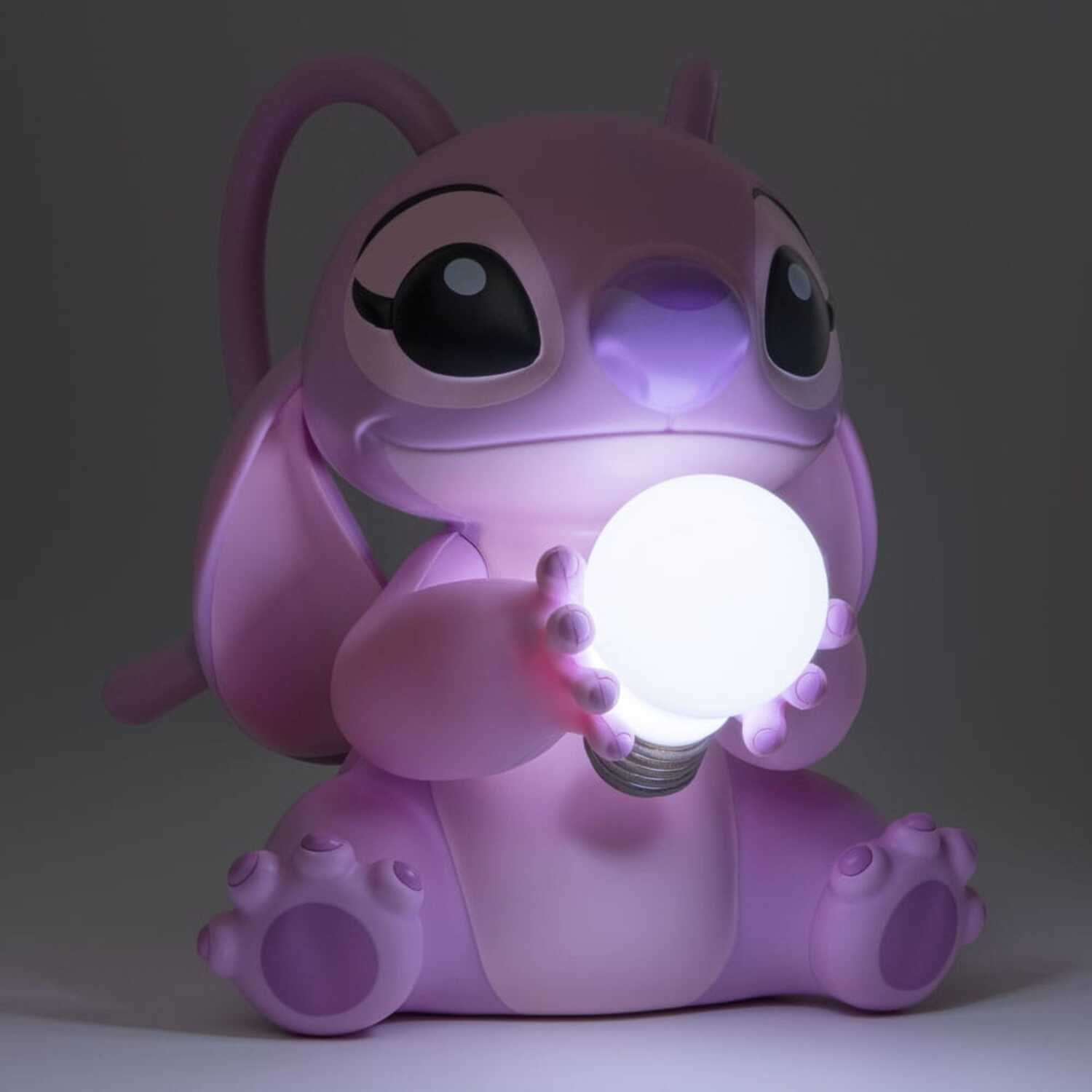A pink Angel from Lilo & Stitch figure holding a lit white ball, on a grey background.