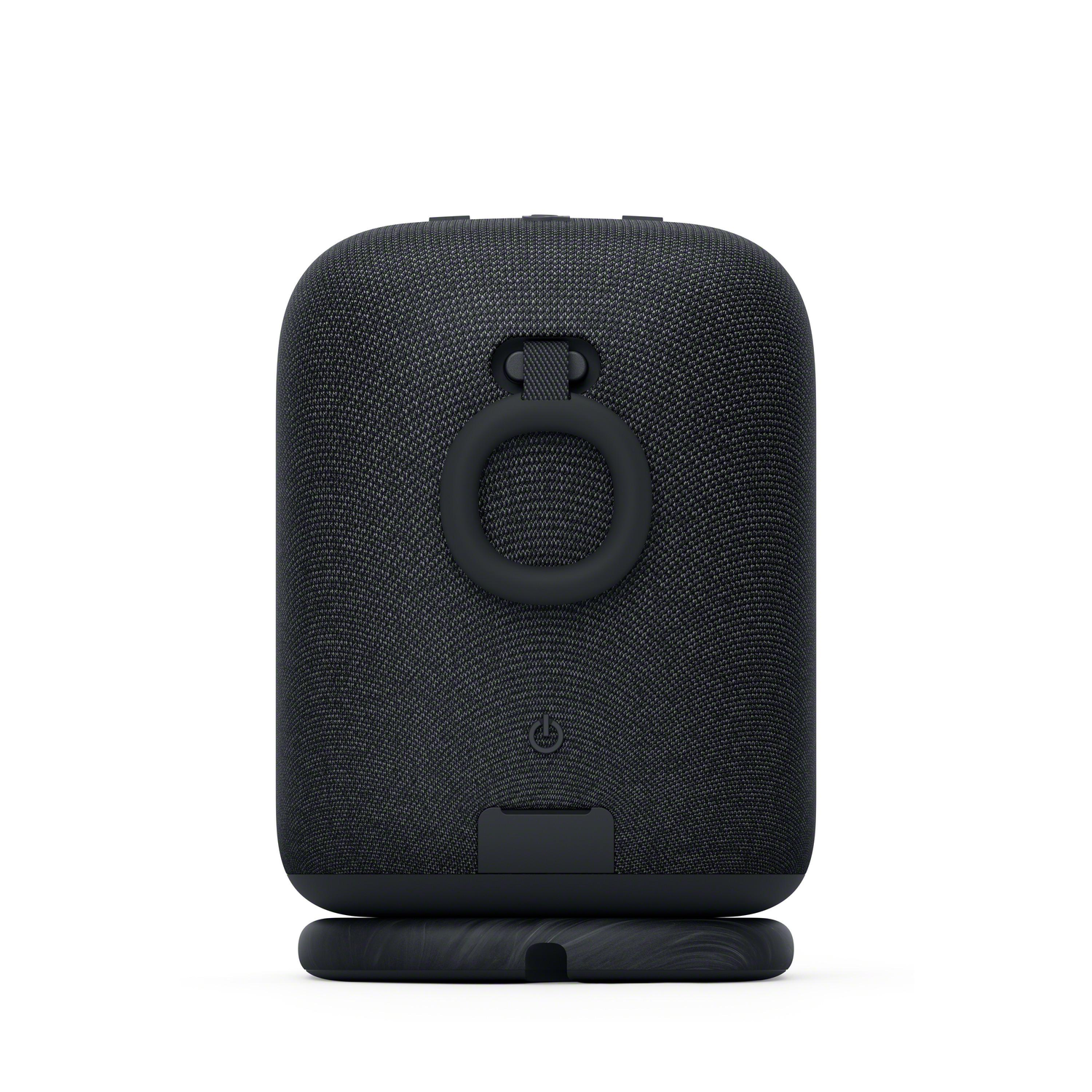 Black speaker on a black base. Speaker has a handle. White background.