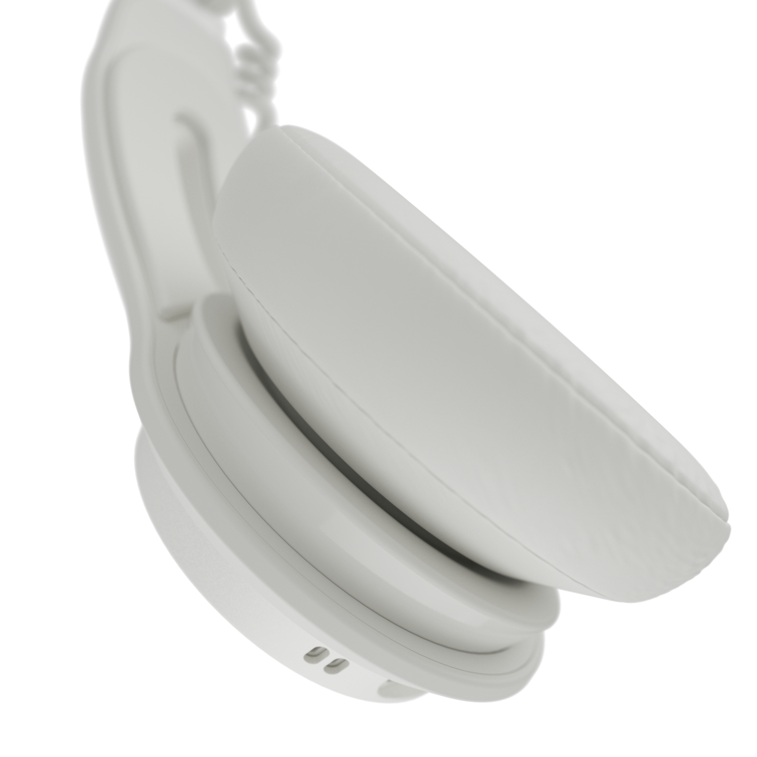White headphones angled, showing the earcups and headband detail against a dark background.