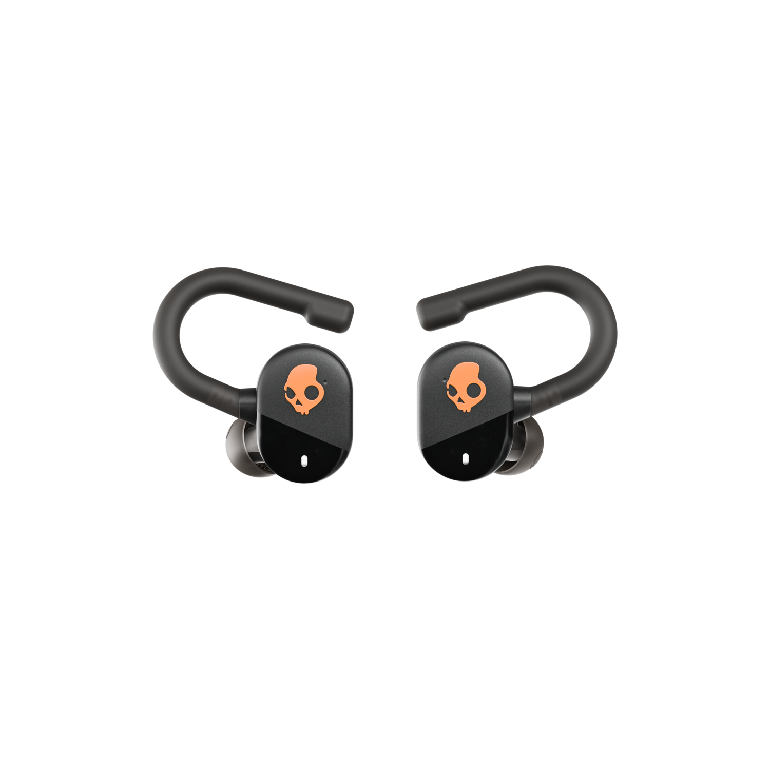 Two black earbud headphones with skull logos, against a black background.