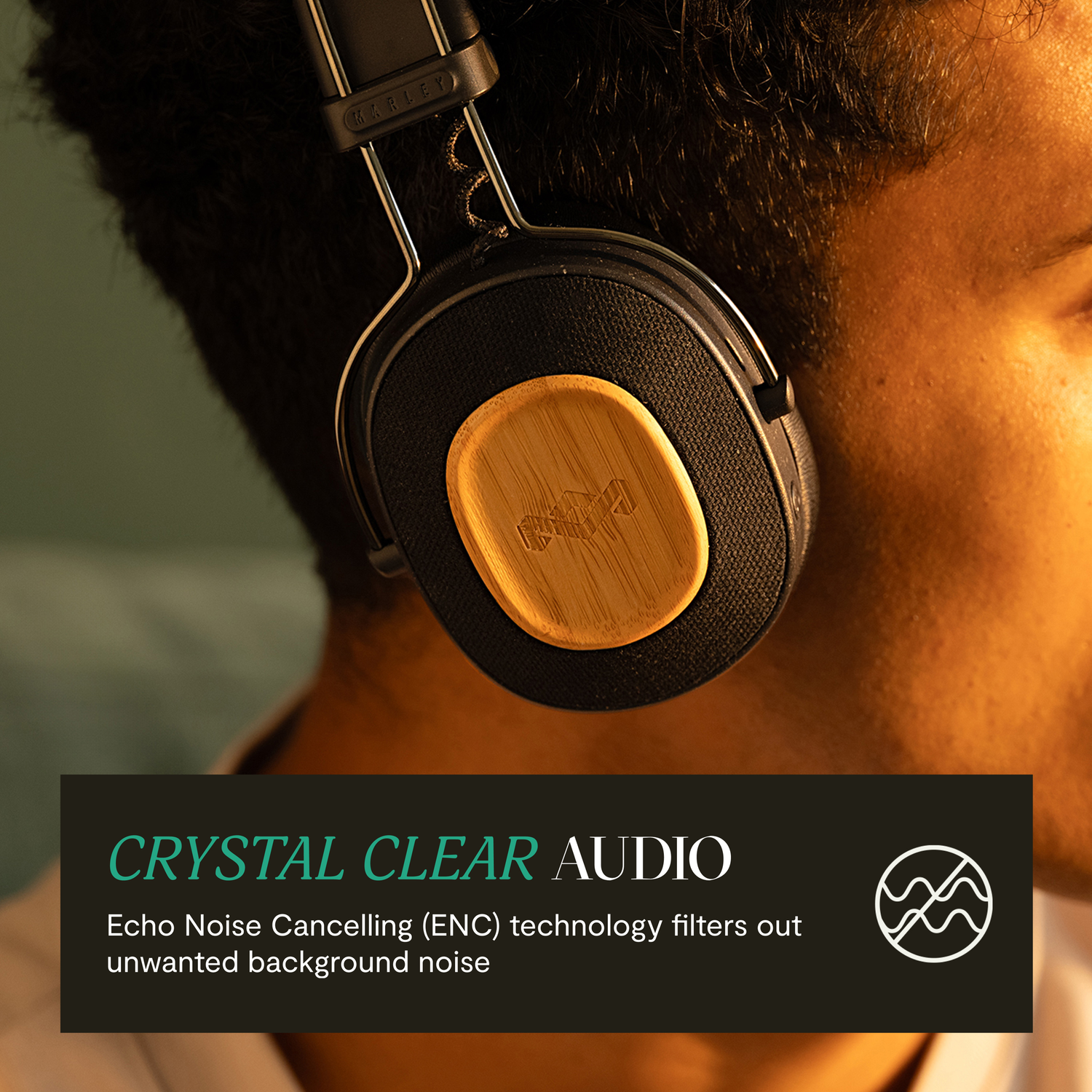 Man wearing Marley headphones with crystal clear audio text and logo.