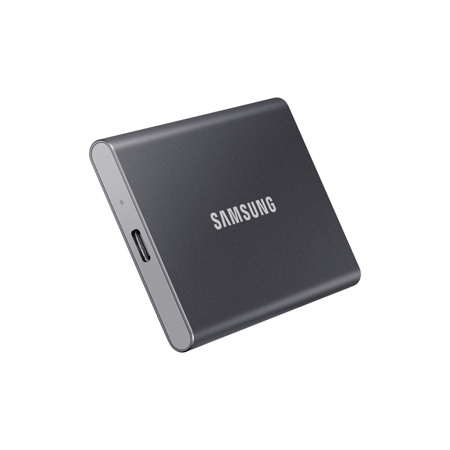 Dark gray Samsung external hard drive on a black background.