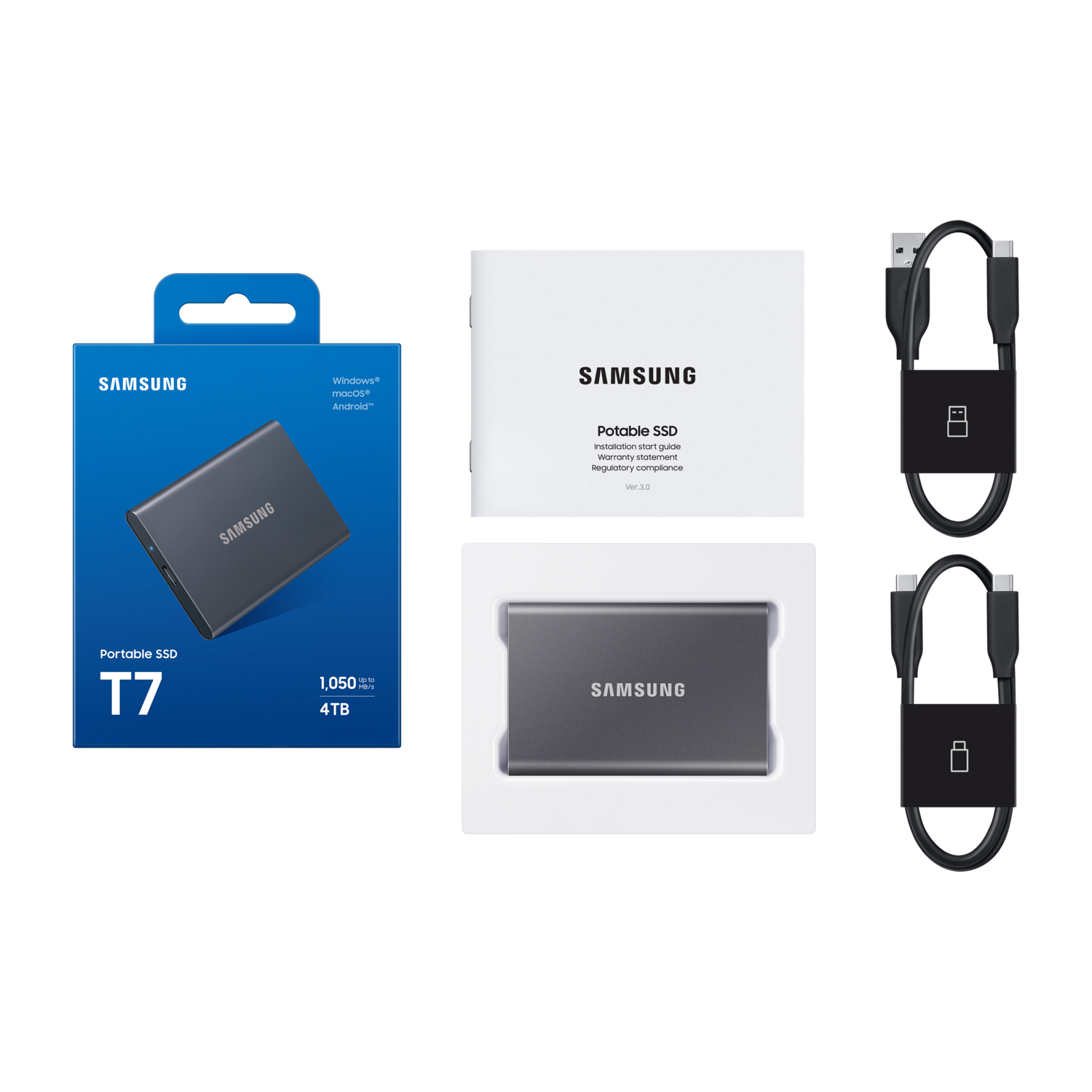 A box with a dark gray SSD and accessories. It includes a portable SSD, cables, and a manual.