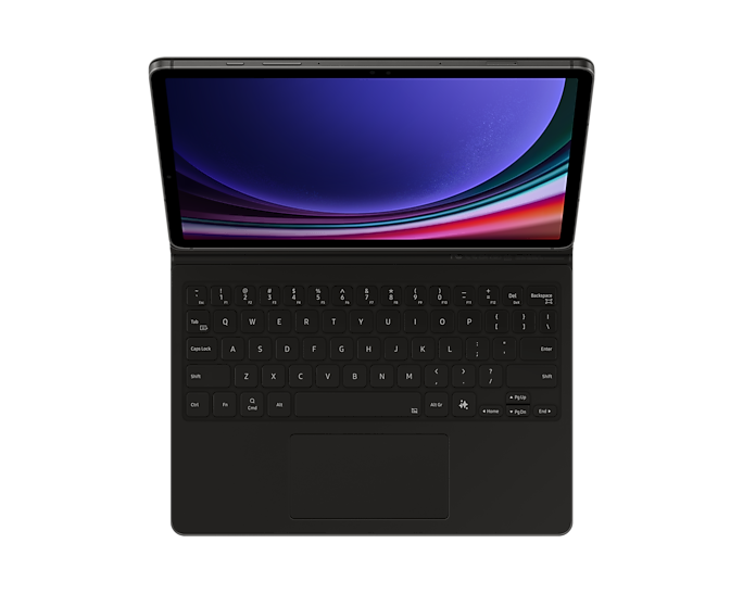 Egy fekete tablet billentyűzet tokkal, színes képernyővel, nyitva az asztalon.