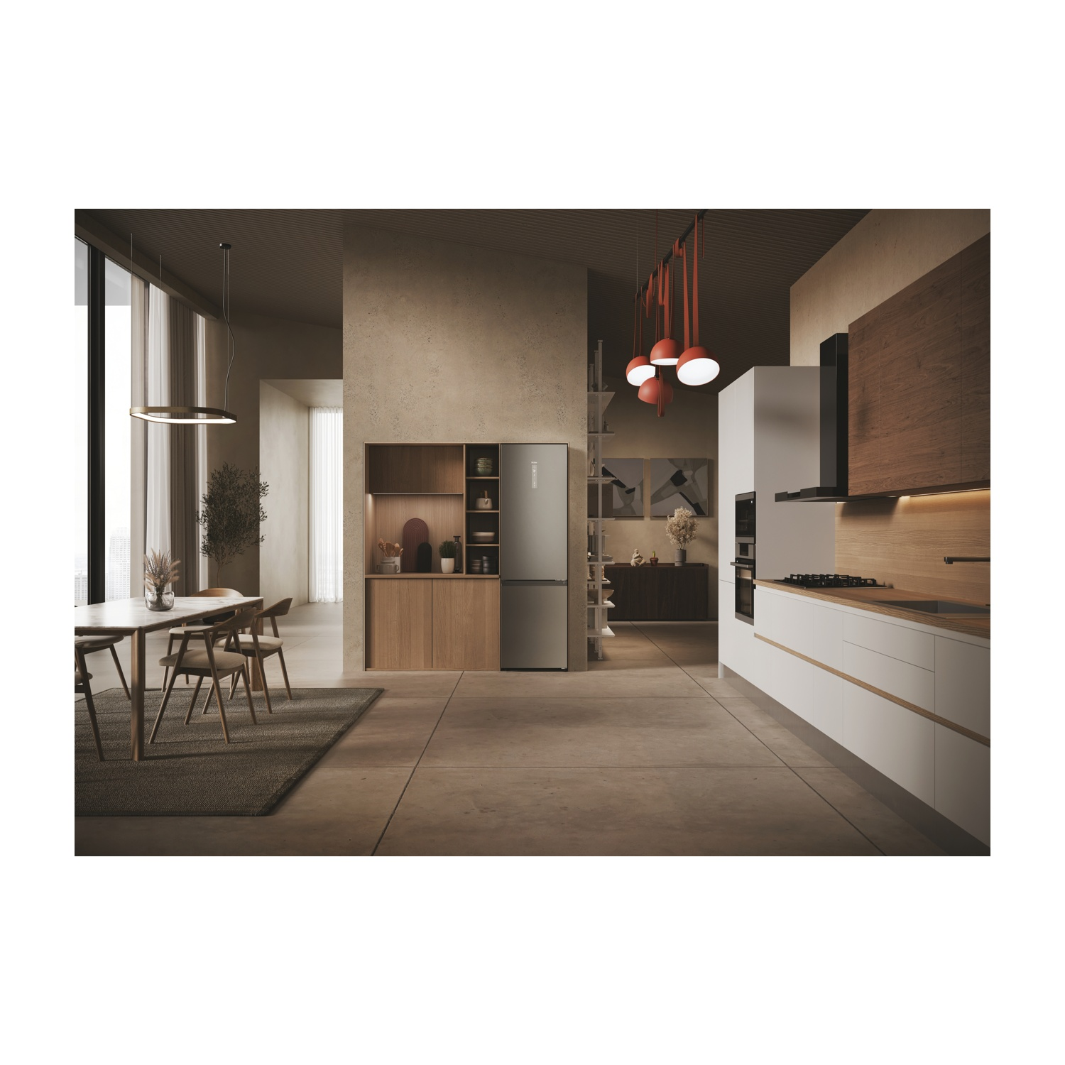 Una cucina moderna con grande frigorifero, tavolo e lampade a sospensione.