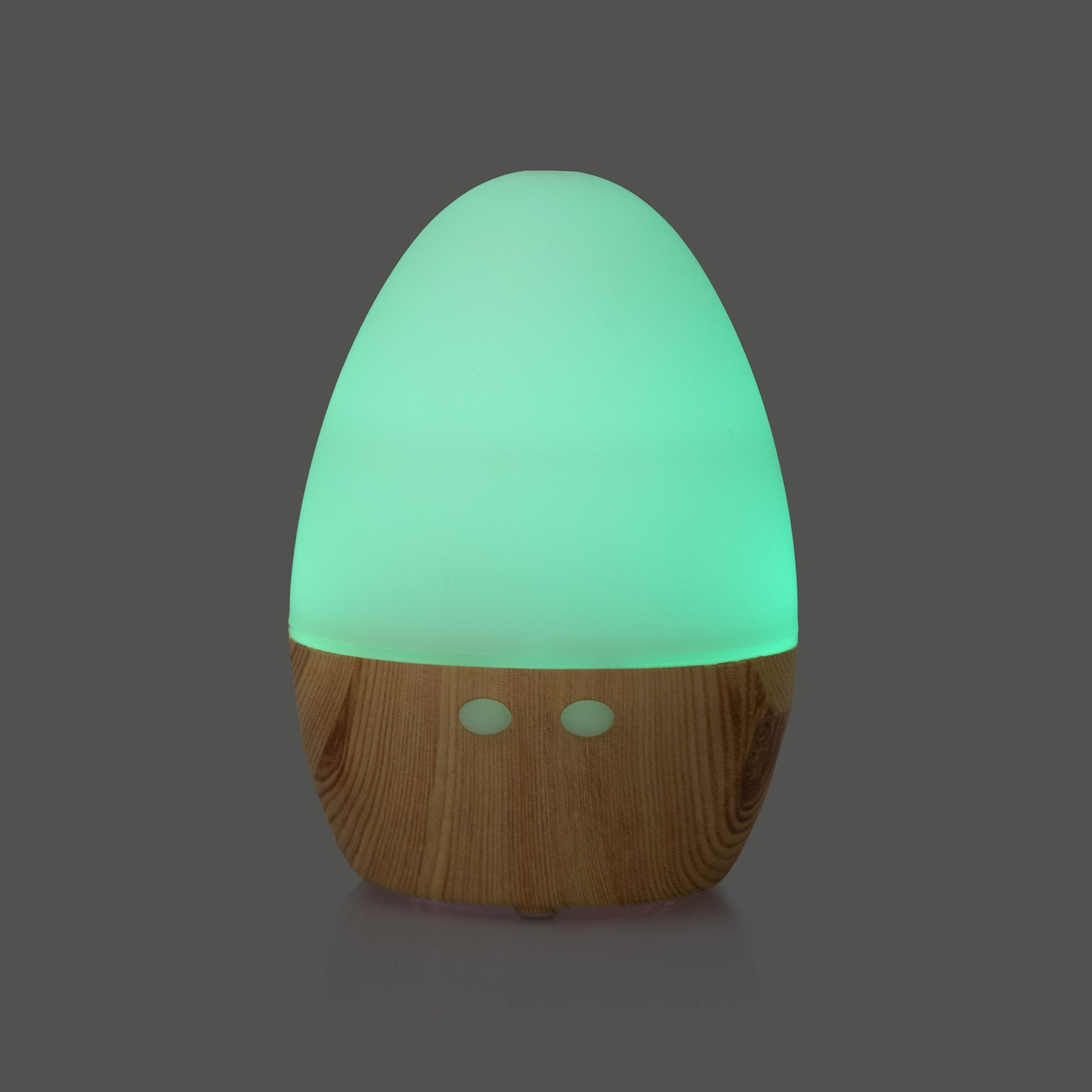 Diffusore di aromi ovale con base in legno e luce verde.