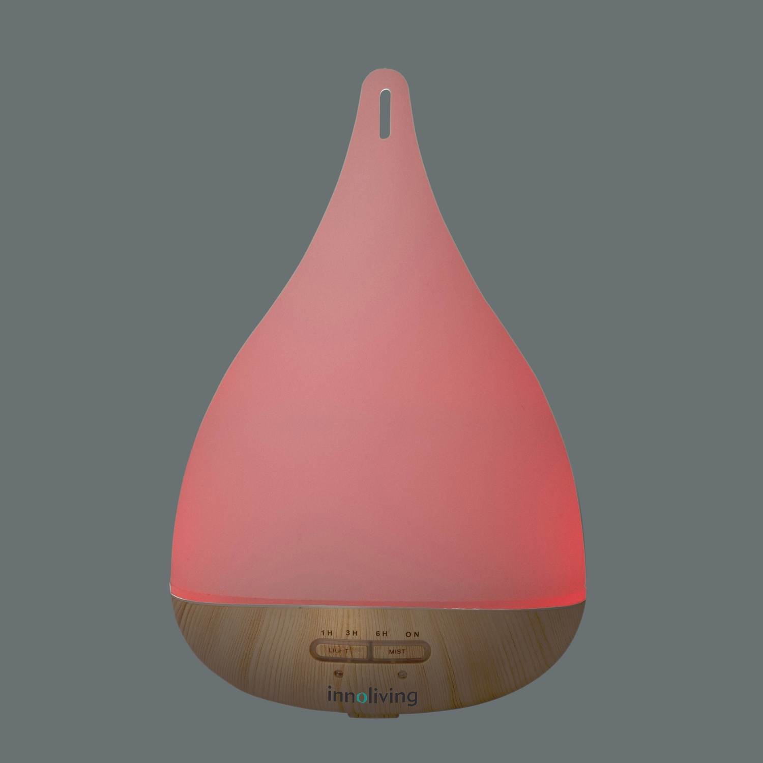 Diffusore rosa a forma di goccia su sfondo grigio, con base in legno, bottoni e logo.