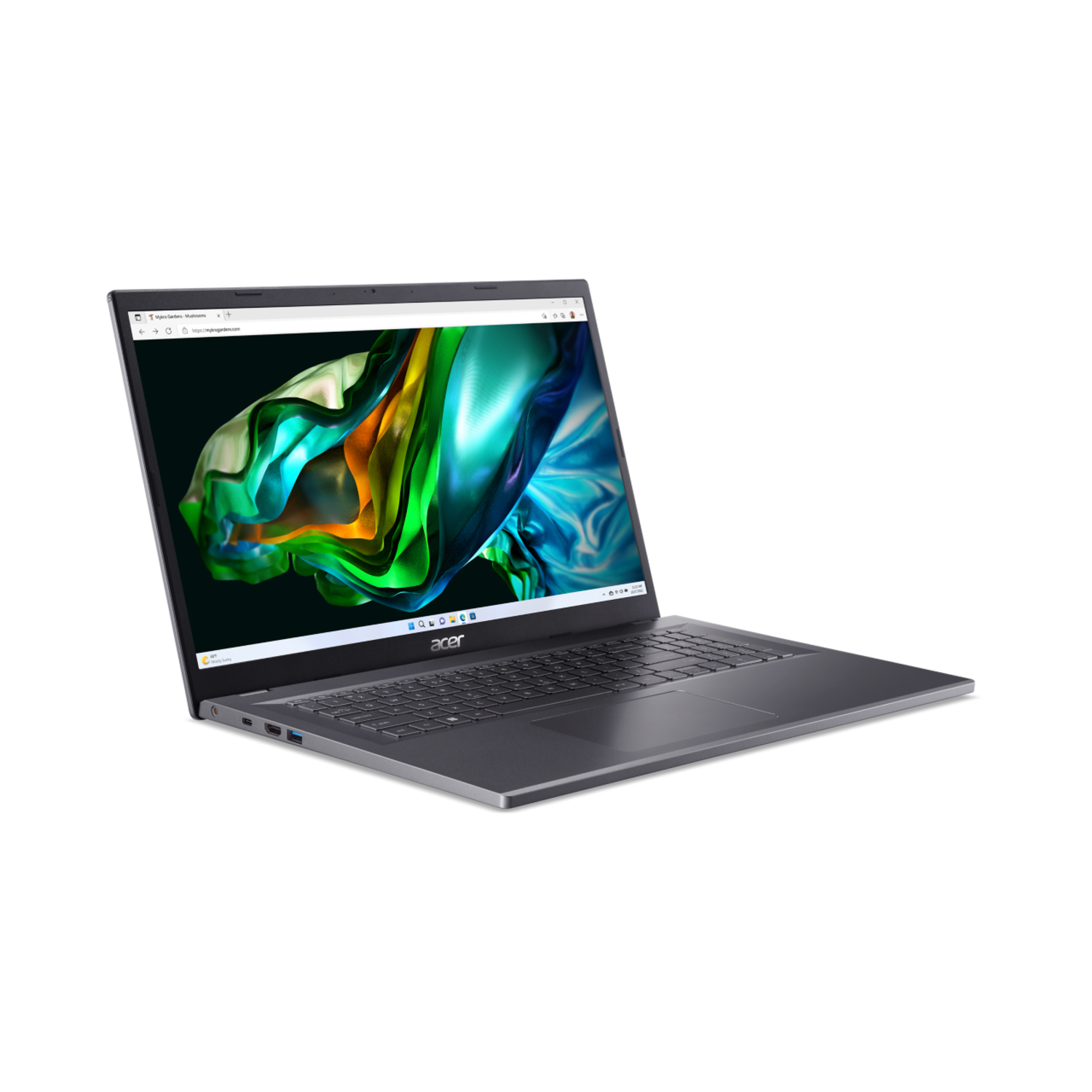 A laptop on a black surface, open and displaying a colorful screen.