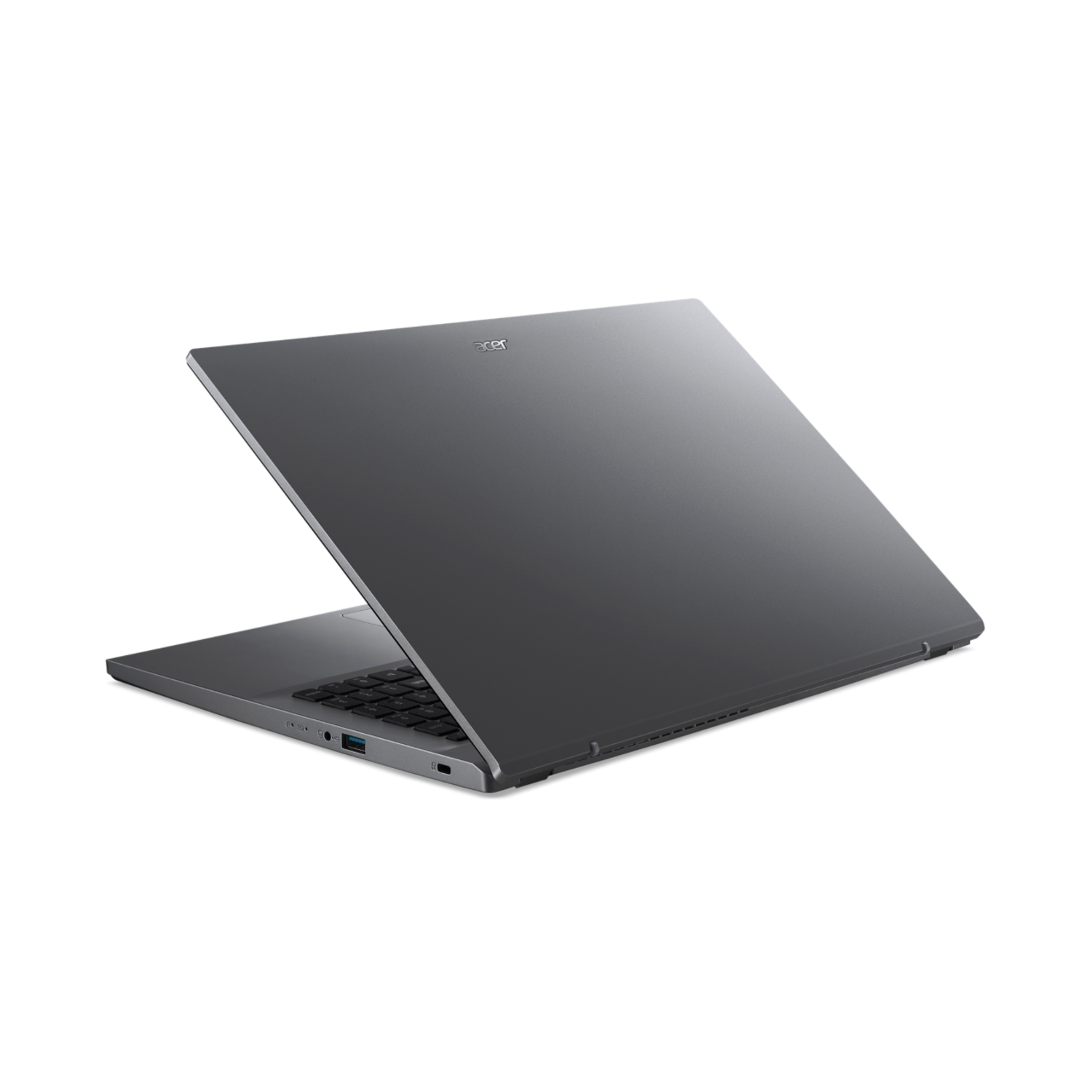 Laptop, open, schuine weergave. Grijze kleur, zwart toetsenbord. Zwarte achtergrond.