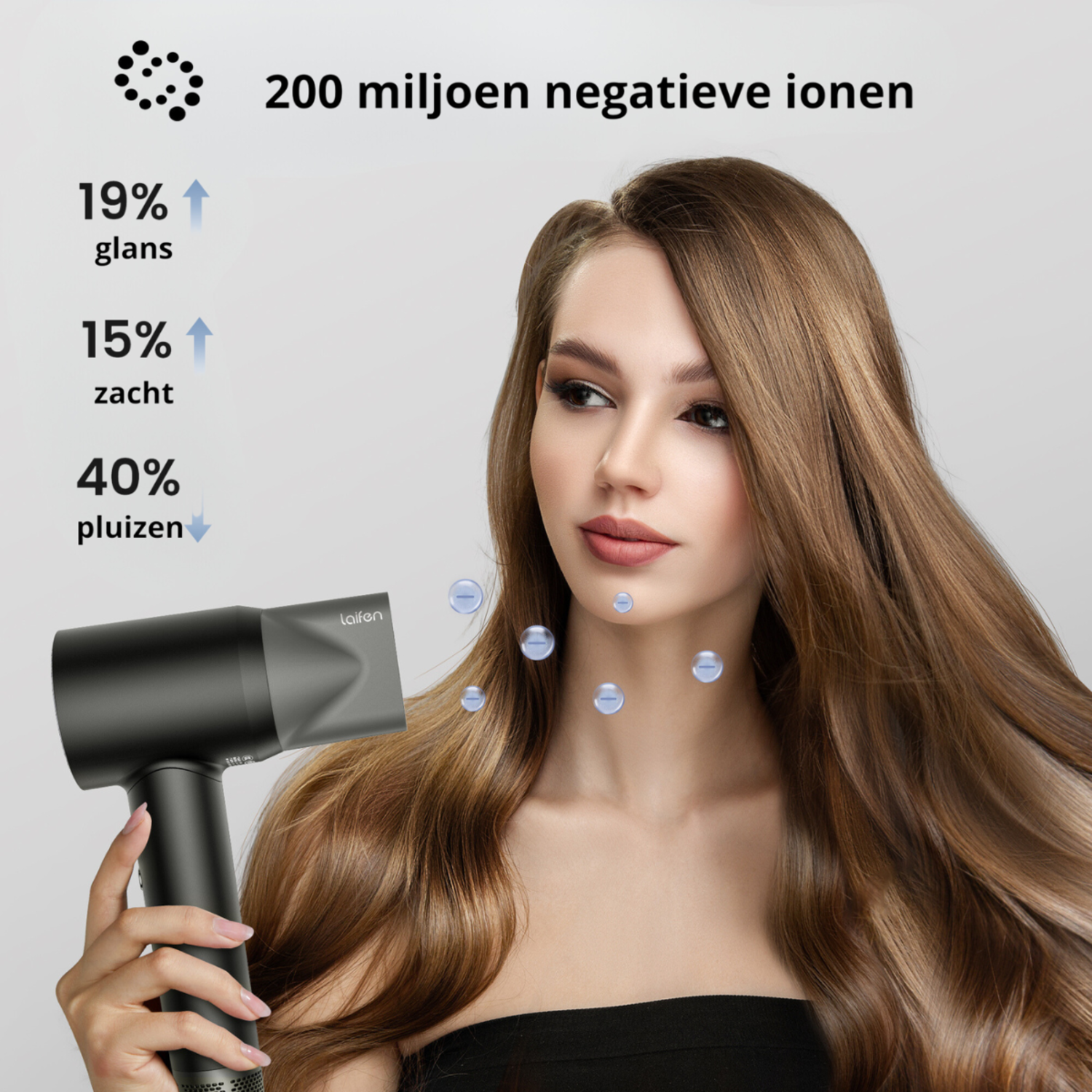 A woman drying her long brown hair with a black hair dryer. Text: 19% gloss, 15% soft, 40% frizz.