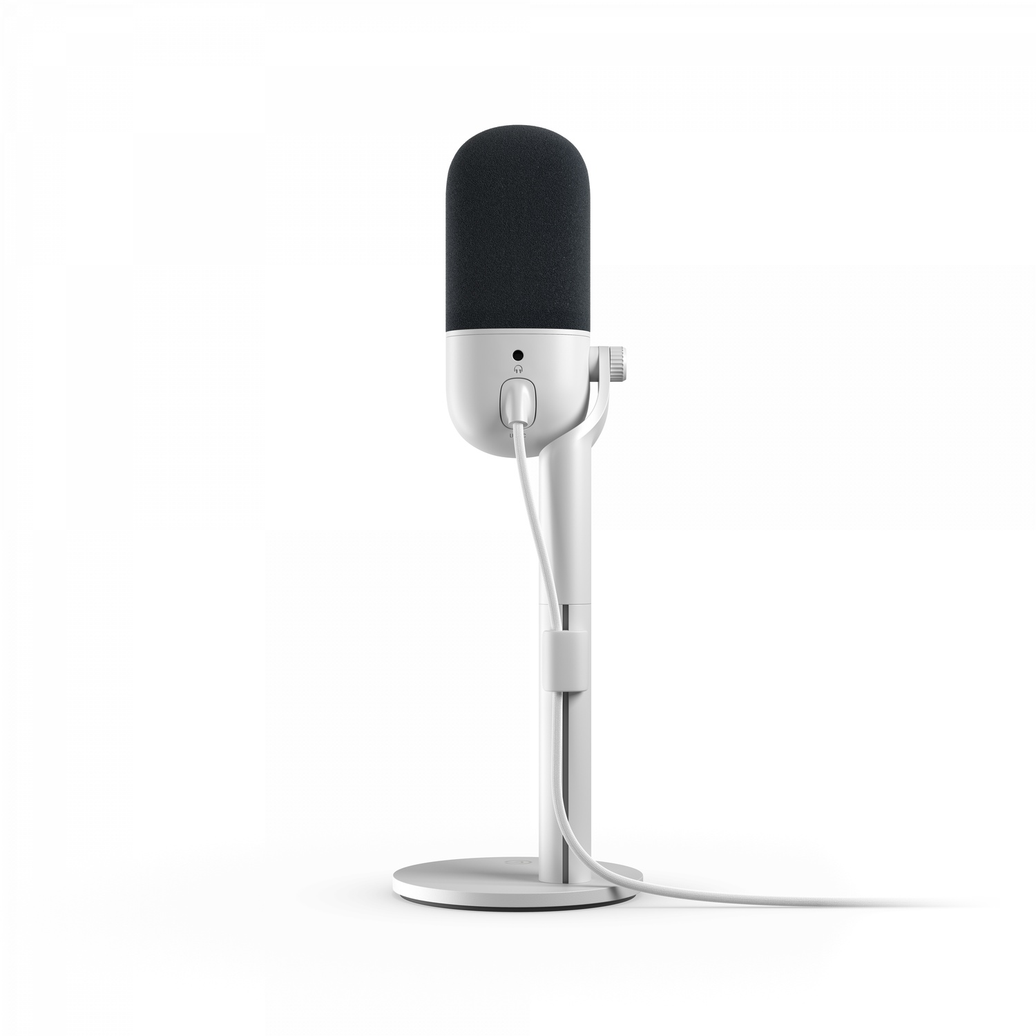 A white microphone on a stand, with a black foam head.