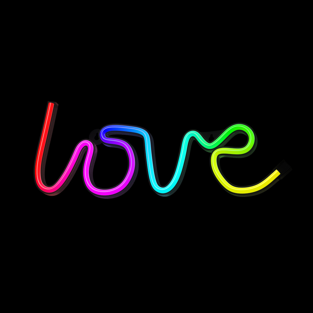 Neon tábla, amelyen a „love” szó látható szivárványszínekben, fekete háttér előtt.