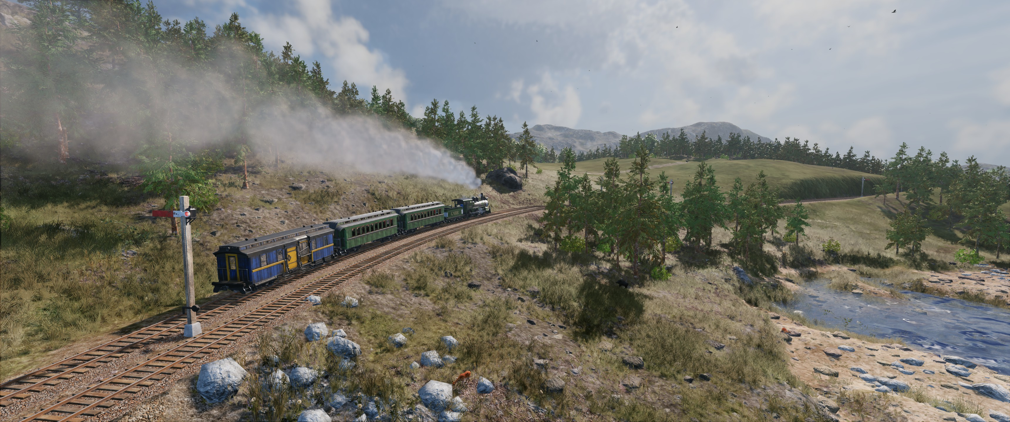 Un treno viaggia lungo un binario attraverso un paesaggio collinare. Il fumo esce dal motore.