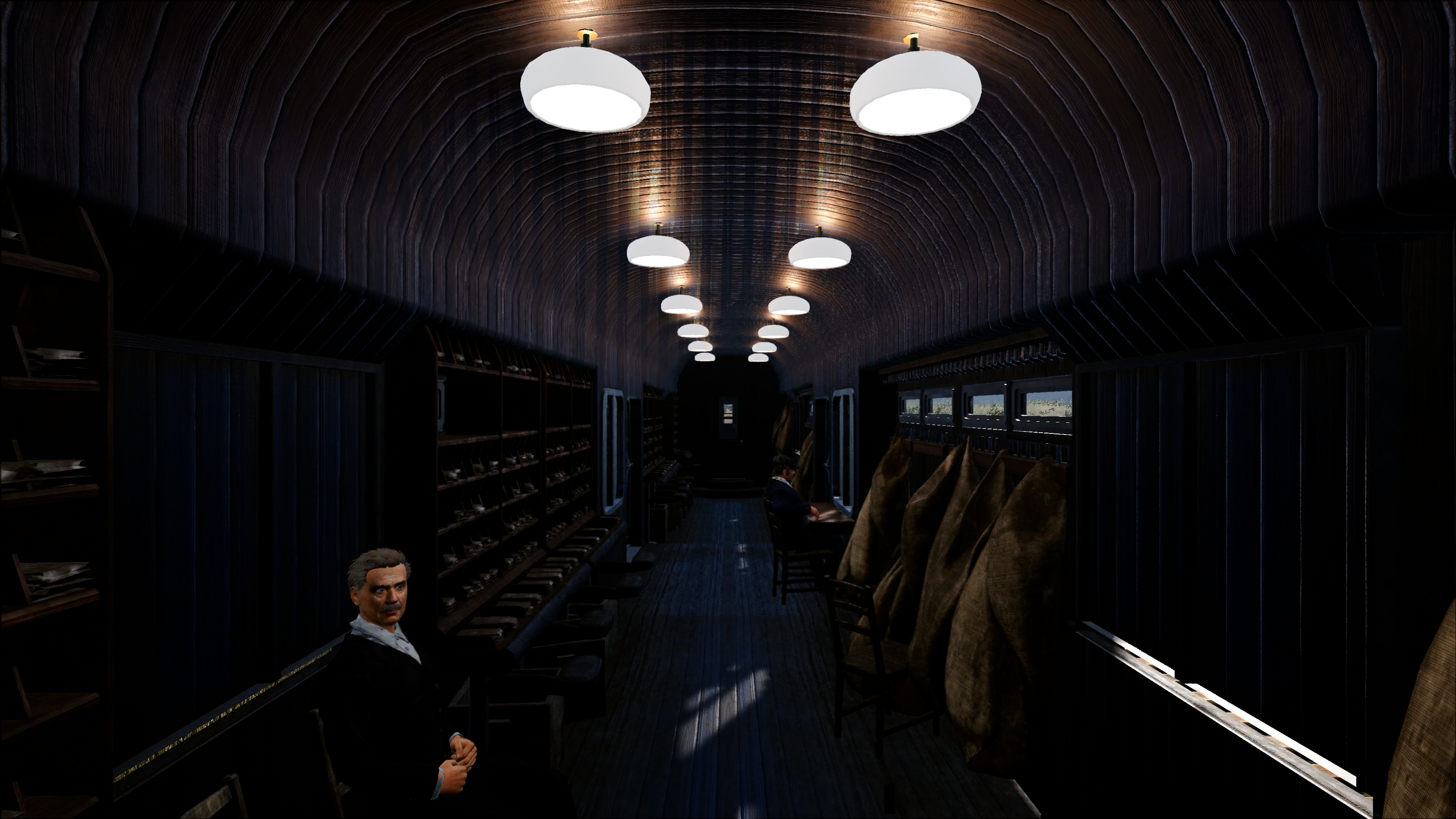 Interno di una carrozza ferroviaria con sedili su entrambi i lati. Un uomo siede a sinistra.